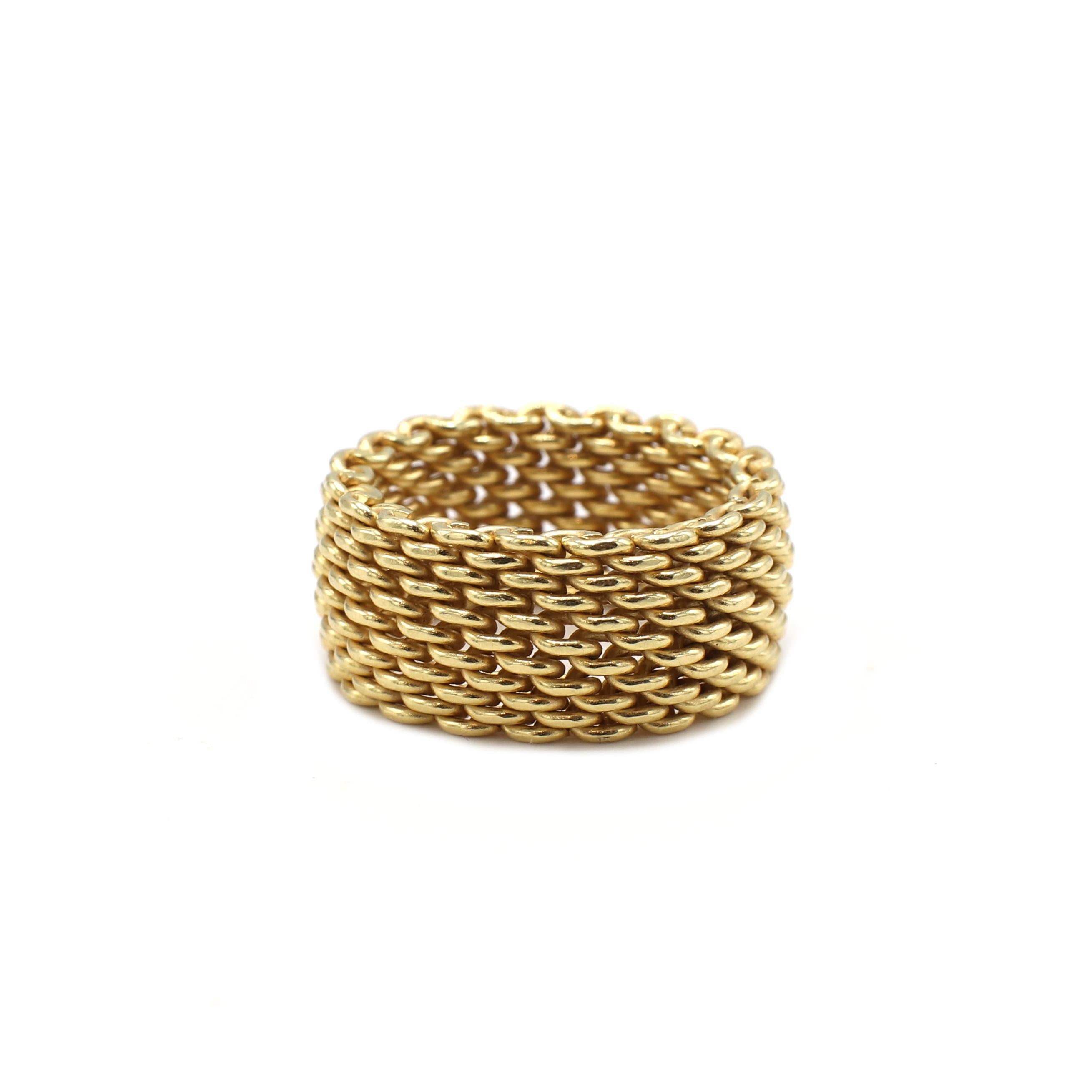 Tiffany & Co. Somerset 18 Karat Yellow Gold Mesh Wide Band Ring 
Metal: 18 karat yellow gold
Weight: 12.47 grams
Width: 10mm
Size: 7.5 (US)
