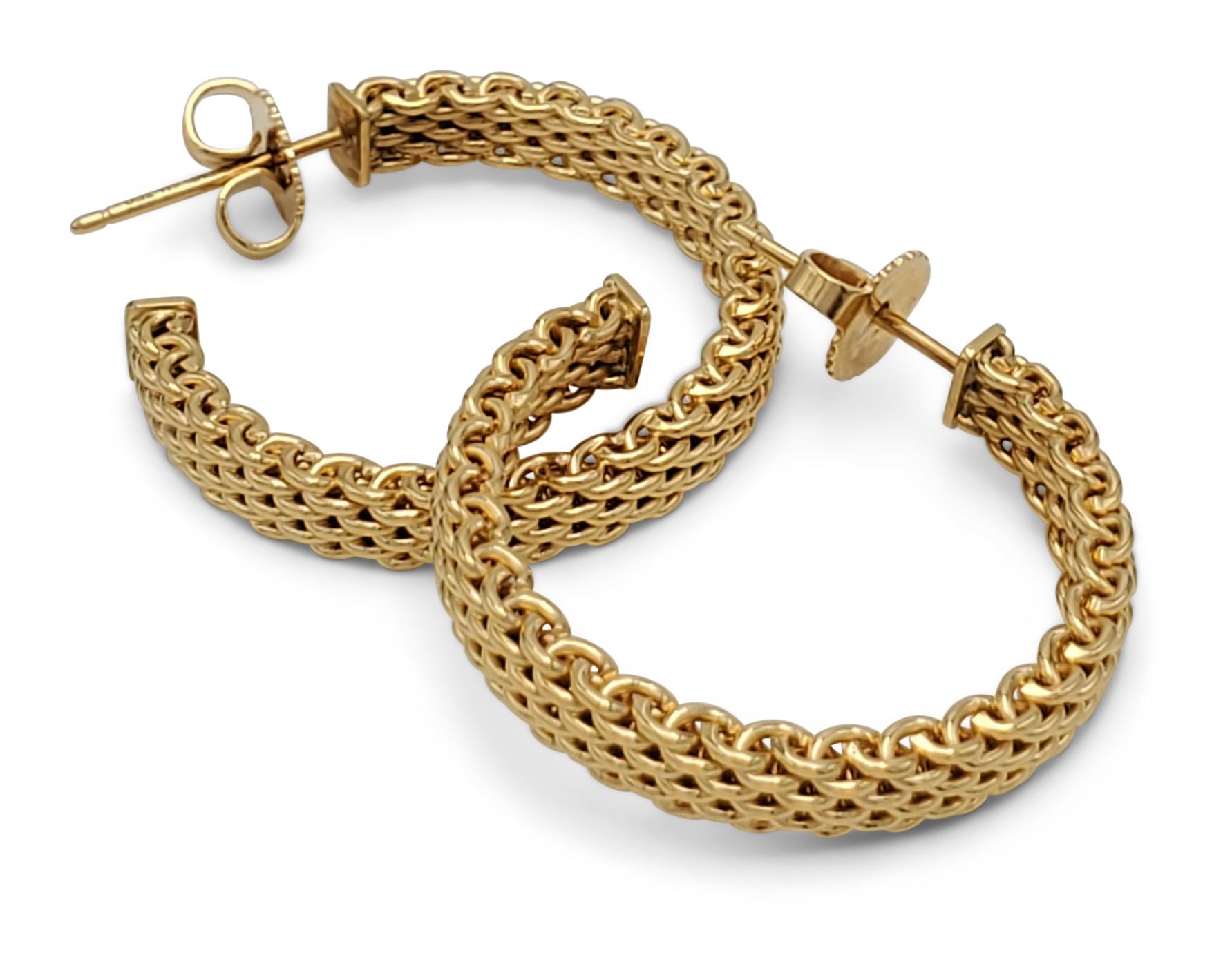 Authentic Tiffany & Co. 'Somerset' mesh hoops crafted in 18 karat yellow gold. Signed T&Co., Au750. The earrings measure 25mm in diameter. Presented with original pouch and box, no papers. CIRCA 2010s. 