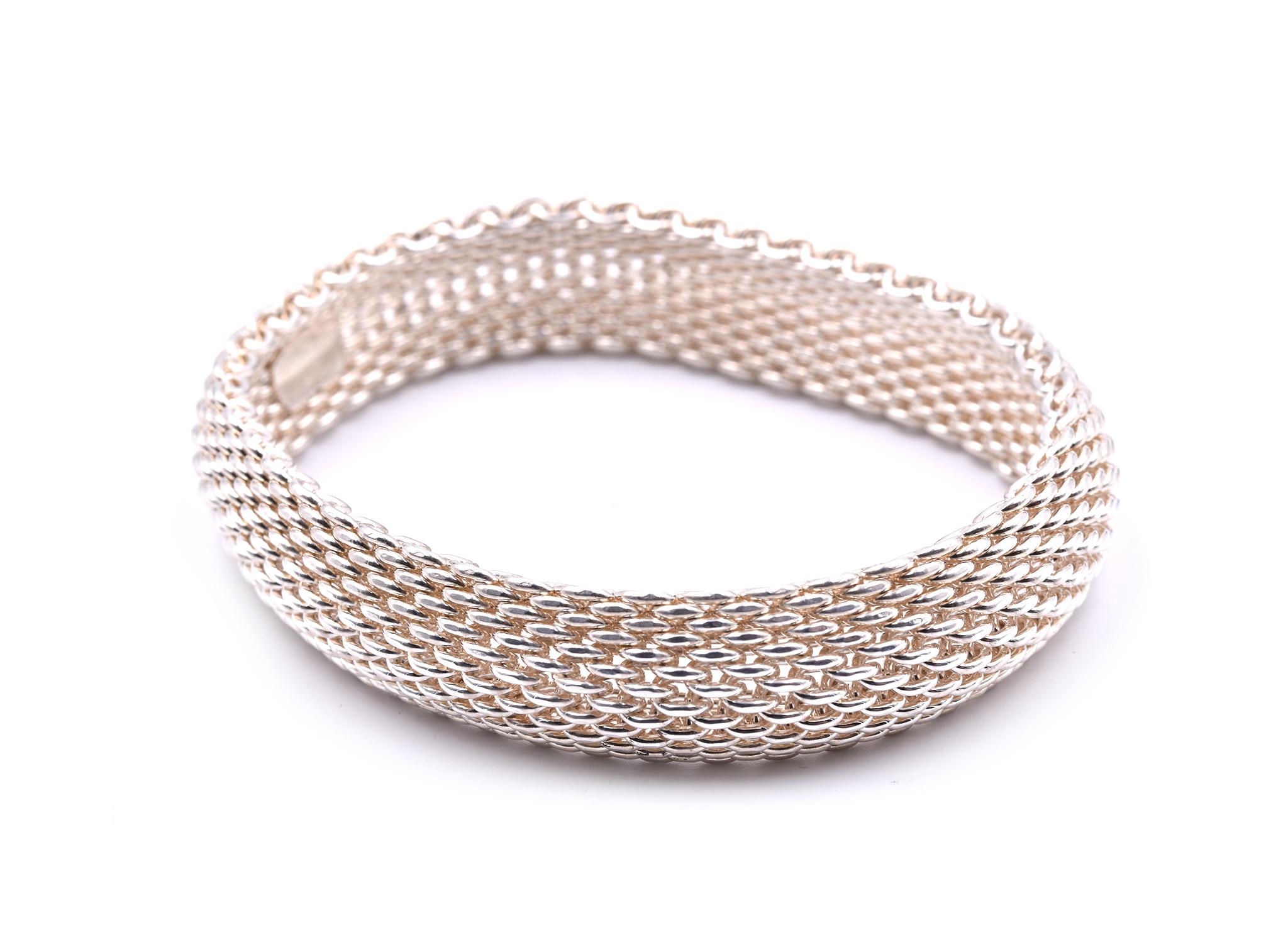 Designer: Tiffany & Co. 
Material: sterling silver
Dimensions: bracelet has an inner diameter of 7 ½ inches and it is 15.30mm wide
Weight: 59.66 grams

