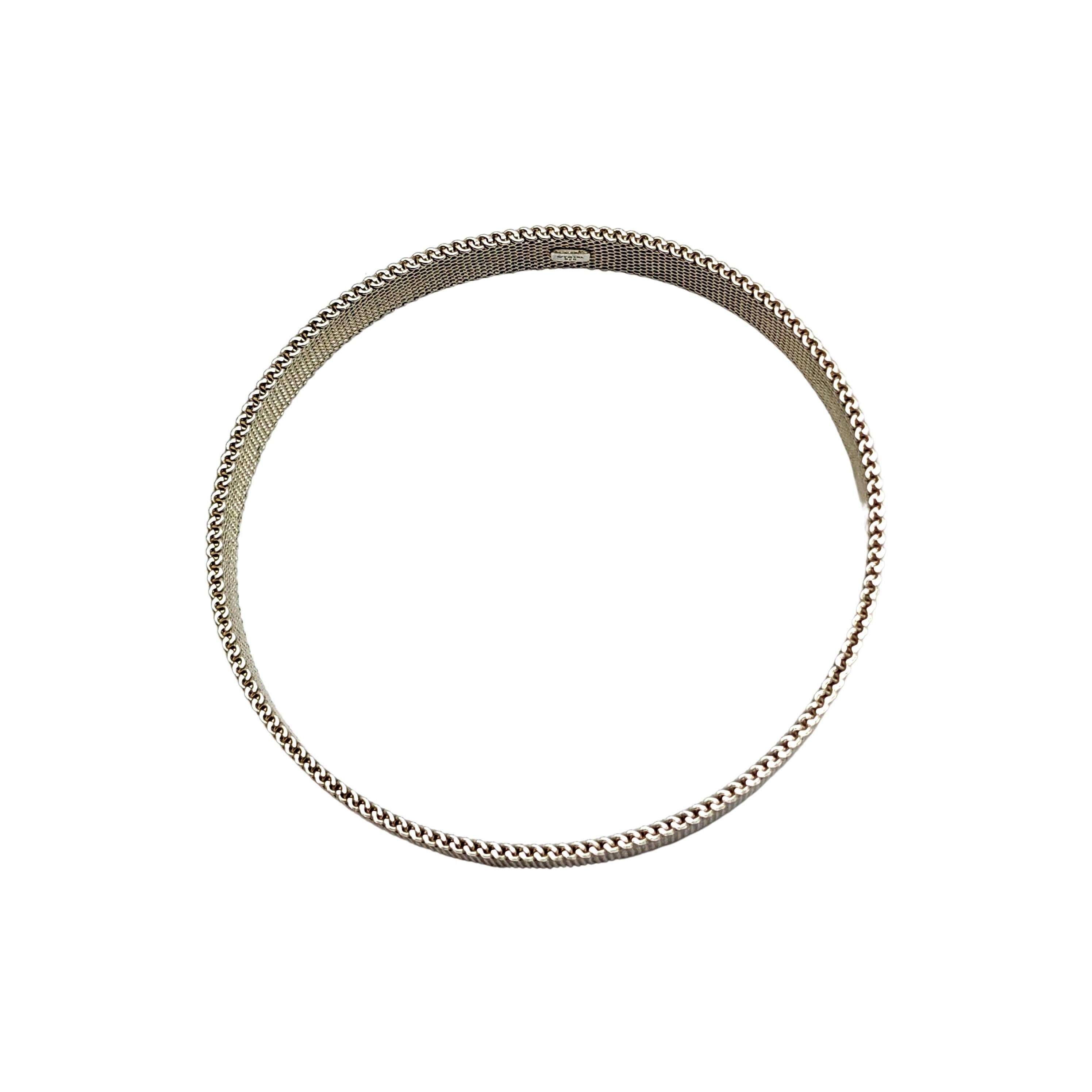 Tiffany & Co sterling silver Somerset mesh rigid bangle.

Authentic Tiffany bangle, narrow size in a fine mesh design. Tiffany pouch and box not included.

Measures approx 7 1/4