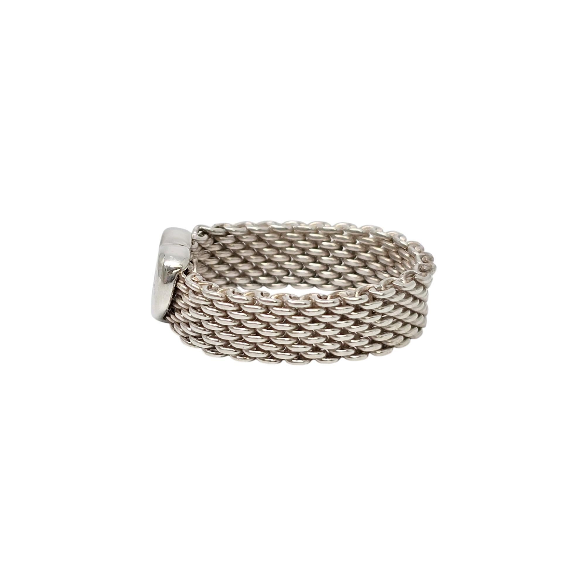 Sterling silver Somerset mesh heart ring by Tiffany & Co.

Size 8

Part of Tiffany's Somerset collection, this ring features a mesh band with an open heart. Tiffany & Co box and pouch are not included.

The band of the ring measures approx 1/4