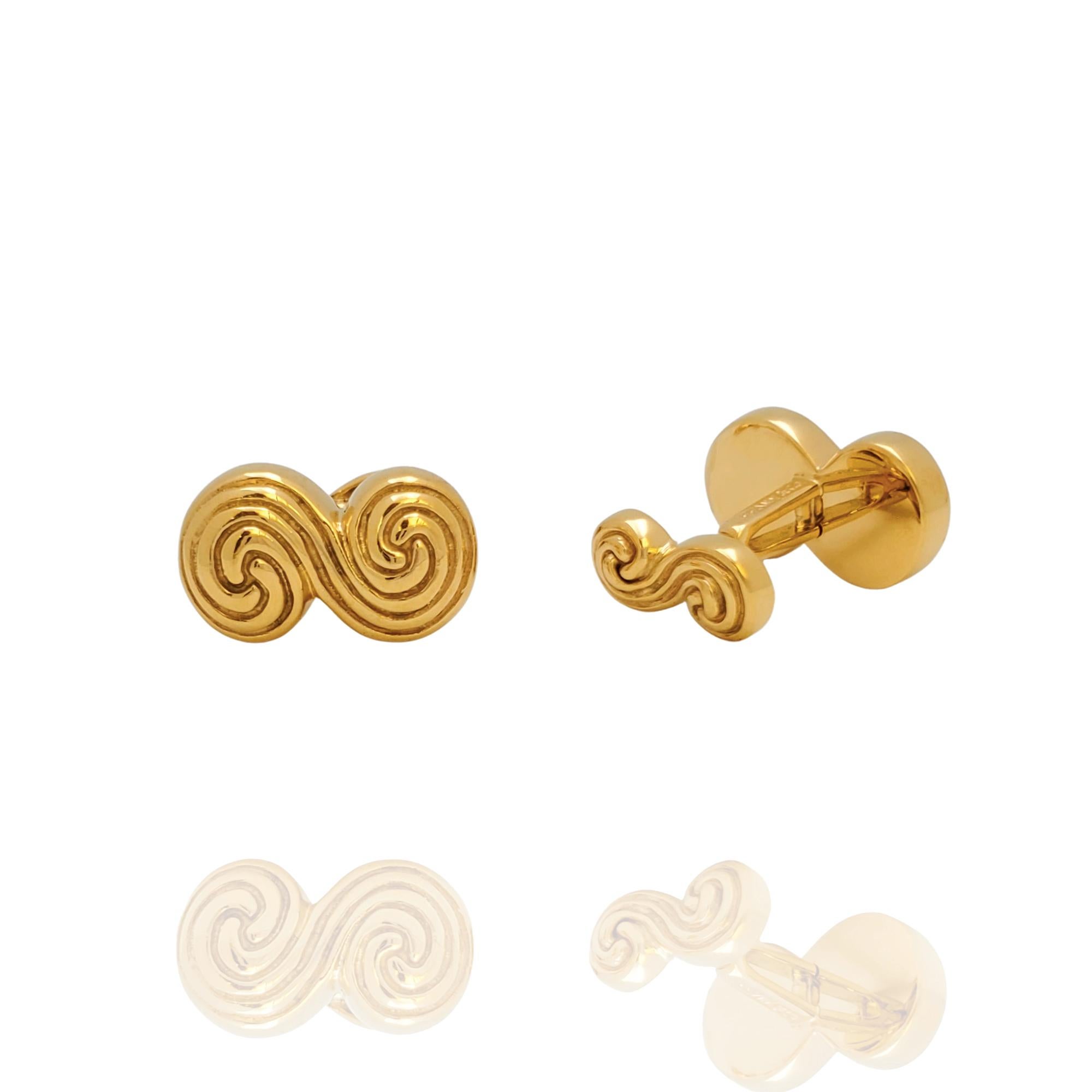 Authentic Tiffany & Co. Spiro Swirl cufflinks crafted in 18 karat yellow gold. These classic cufflinks are designed with deep grooves in the form of the letter S. Signed Tiffany & Co., 750, 1995. The cufflinks are presented with Tiffany & Co. pouch,