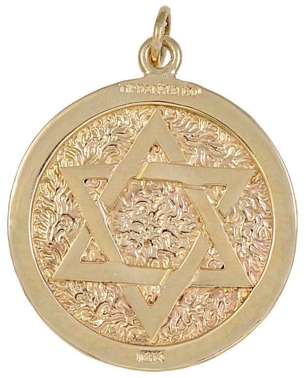 A well-detailed 18k gold St Christopher medal with high relief. On the reverse side is a large star of David. Made and signed by Tiffany & Co. A very unique piece.

Alice Kwartler has sold the finest antique gold and diamond jewelry and silver for