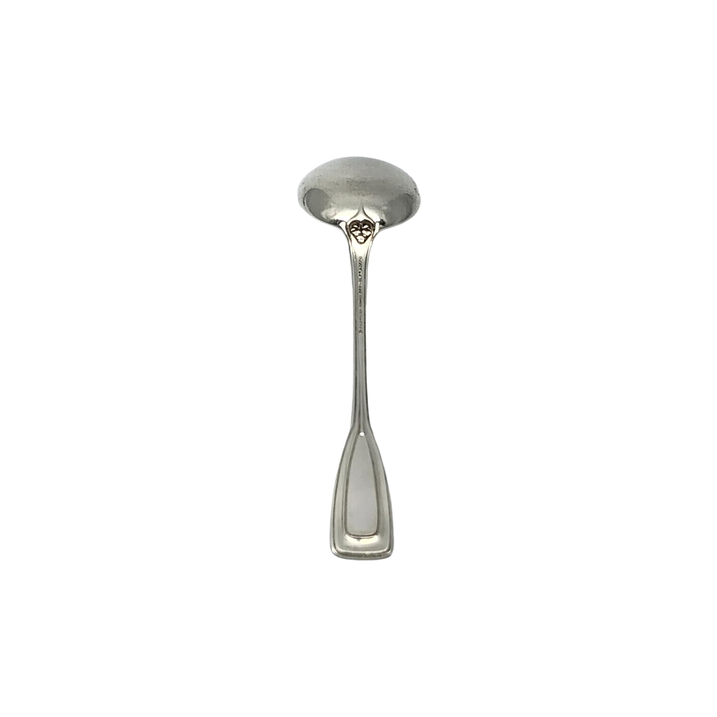 Sterling silver round bowl bouillon soup spoon by Tiffany & Co in the St. Dunstan pattern with monogram.

Monogram appears to be W

Designed by Albert A. Southwick in 1909 and named for the patron saint of gold and silversmiths, Tiffany's St.