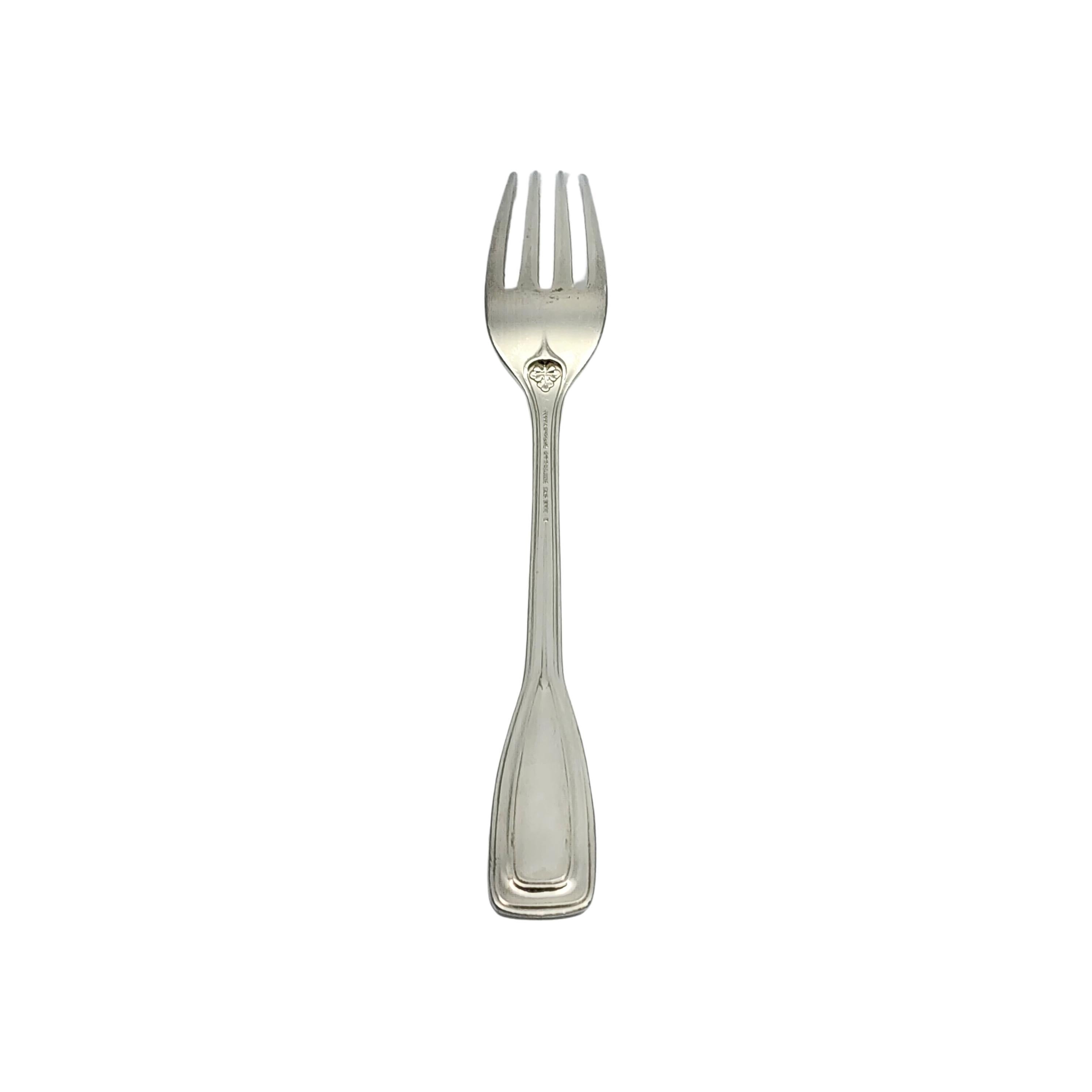 Sterling silver fork by Tiffany & Co in the St. Dunstan pattern with monogram.

Monogram appears to be W

Designed by Albert A. Southwick in 1909 and named for the patron saint of gold and silversmiths, Tiffany's St. Dunstan pattern is a classic Art