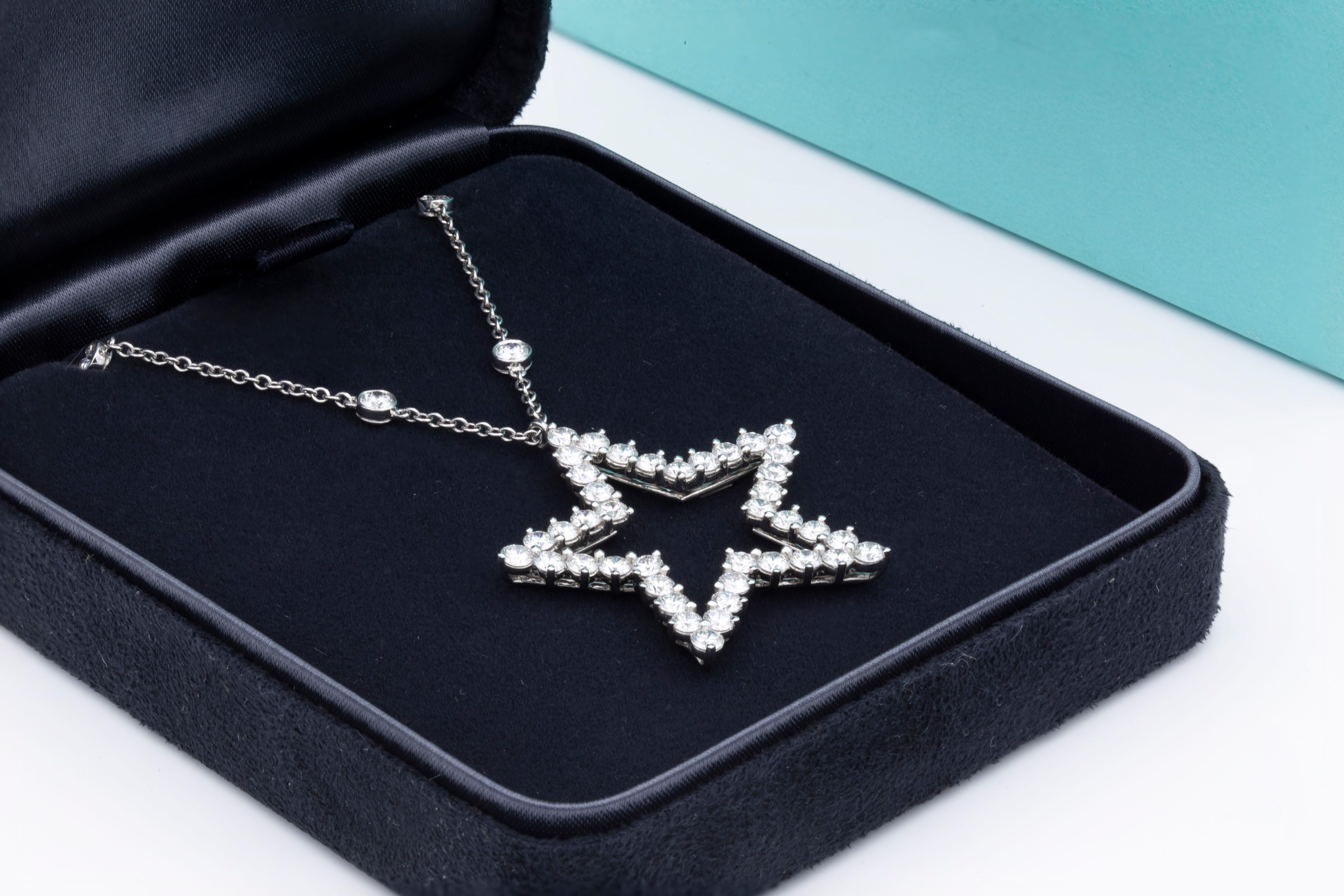 Star Diamond Pendant from Tiffany & Co

Crafted from platinum featuring twelve diamonds set along the length of chain and forty brilliant round diamonds forming the shape of a star.

Stamped PT 950 & original hallmark

Total carat value: 4.65 Carats