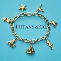 Tiffany & Co. Colgante con dijes de estrella de mar en oro amarillo de 18k y diamantes
