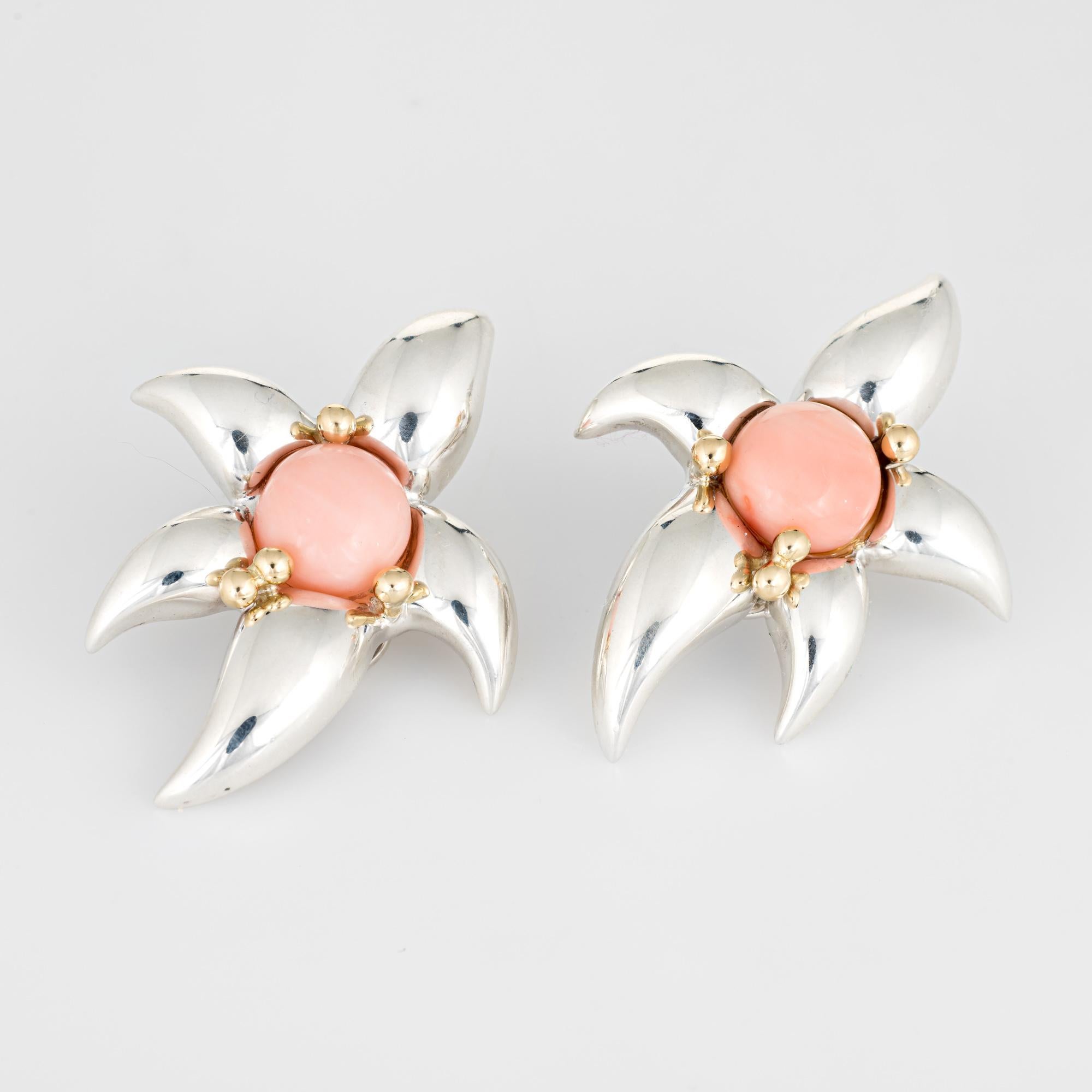 Finely detailed pair of vintage Tiffany & Co starfish earrings (circa 1993) crafted in sterling silver & 18k yellow gold. 

Two cabochon cut pieces of coral each measure 10mm. The coral is in excellent condition and free of cracks or chips. 

The