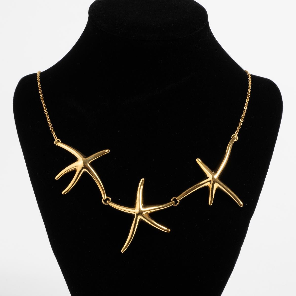 Our vintage and rare Tiffany & Co starfish necklace was designed by Elsa Peretti and part of the Elsa Peretti range. Comprising three linked Starfish, and necklace all of 18k yellow gold, this beautiful piece comes with its original Tiffany & Co