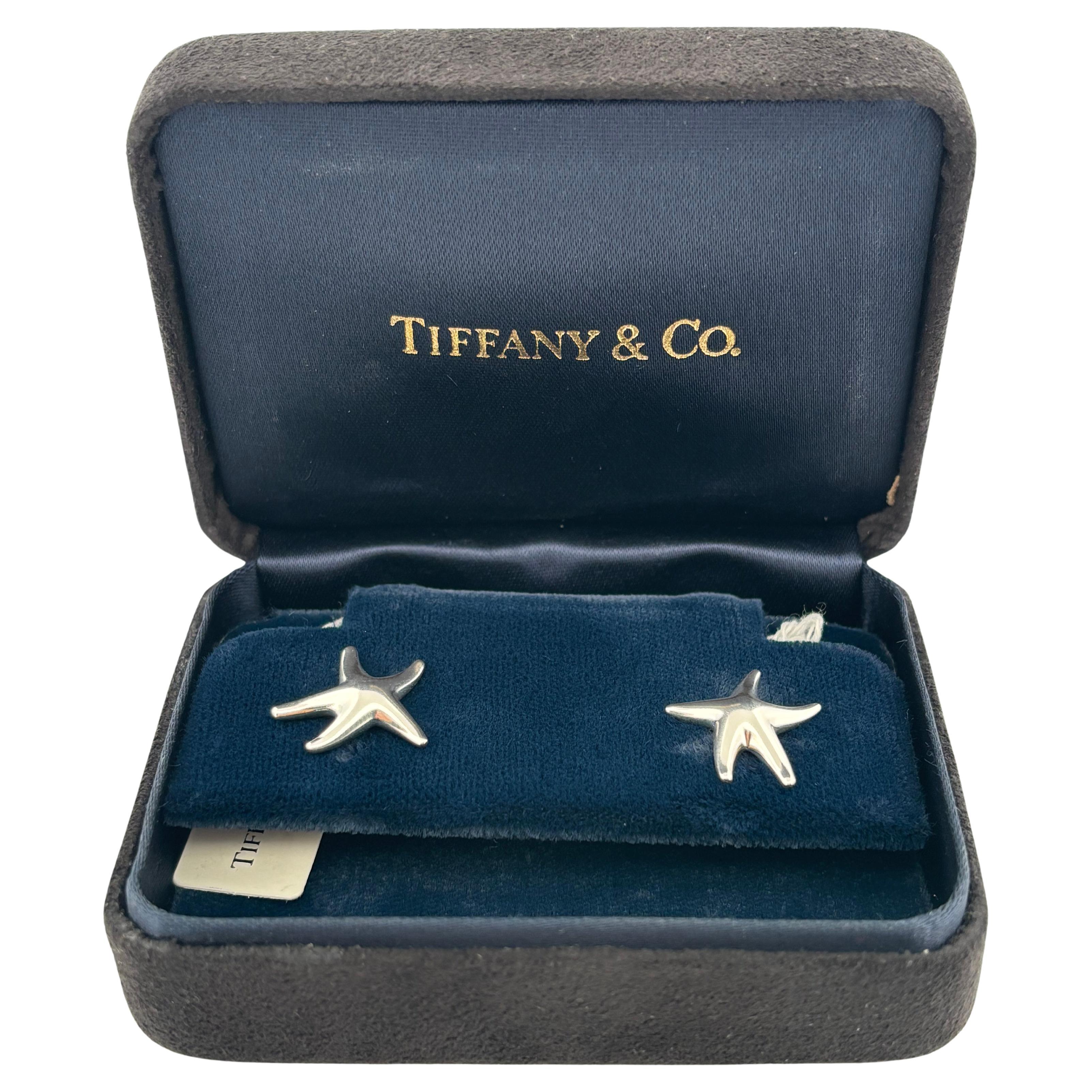 These elegant sterling silver starfish stud earrings, designed by the legendary Elsa Peretti for Tiffany & Co., embody timeless seaside charm with refined craftsmanship. Weighing a combined 3.8 grams, each earring features Peretti’s signature