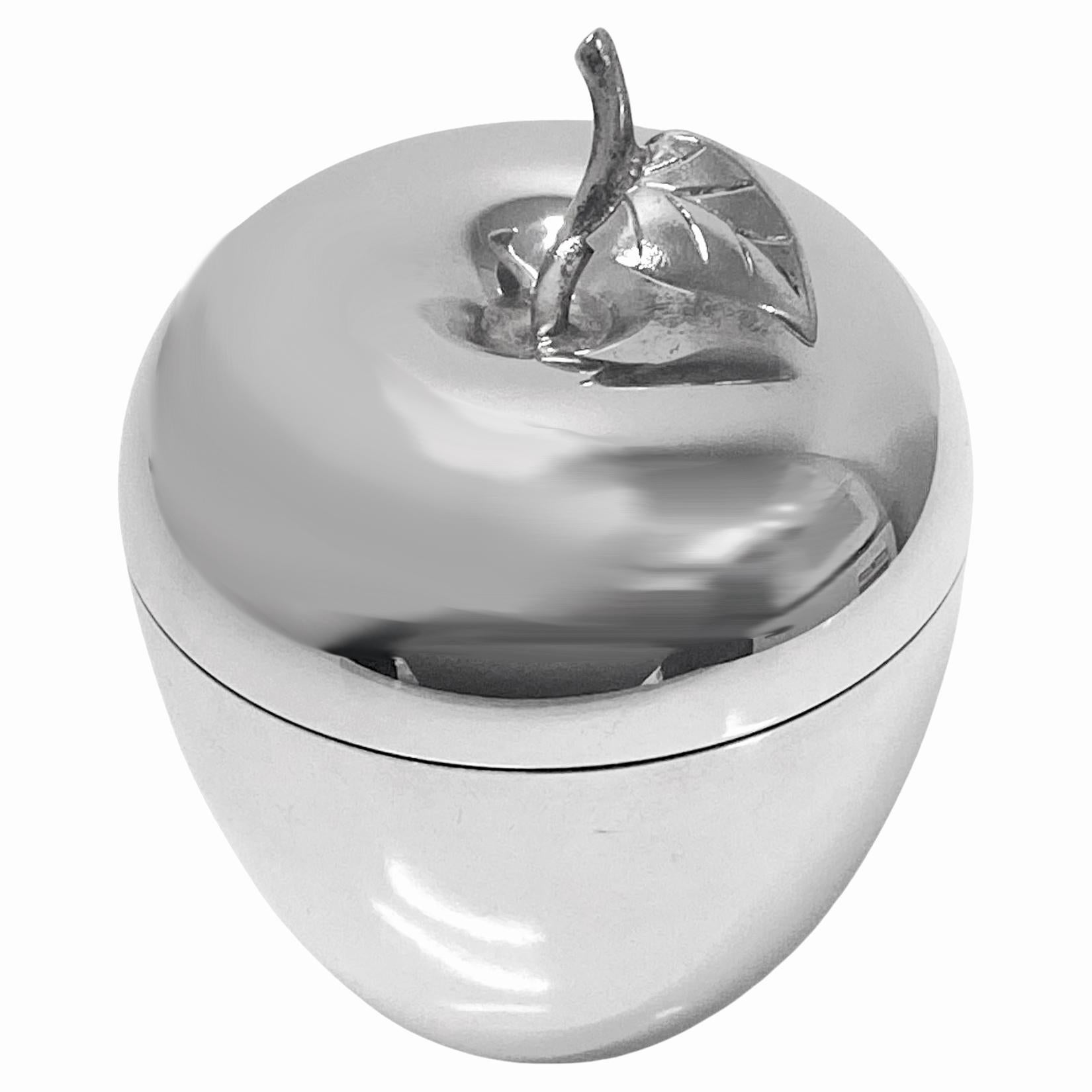 Tiffany & Co Sterling Apple covered container jar box. New York 20th century. Apple form with leafy stem. Measures: 4.25 x 3.50 inches. Weight: 6.94 oz. Marked Tiffany & Co Makers Sterling Silver 23748. Condition: Good All reflections from