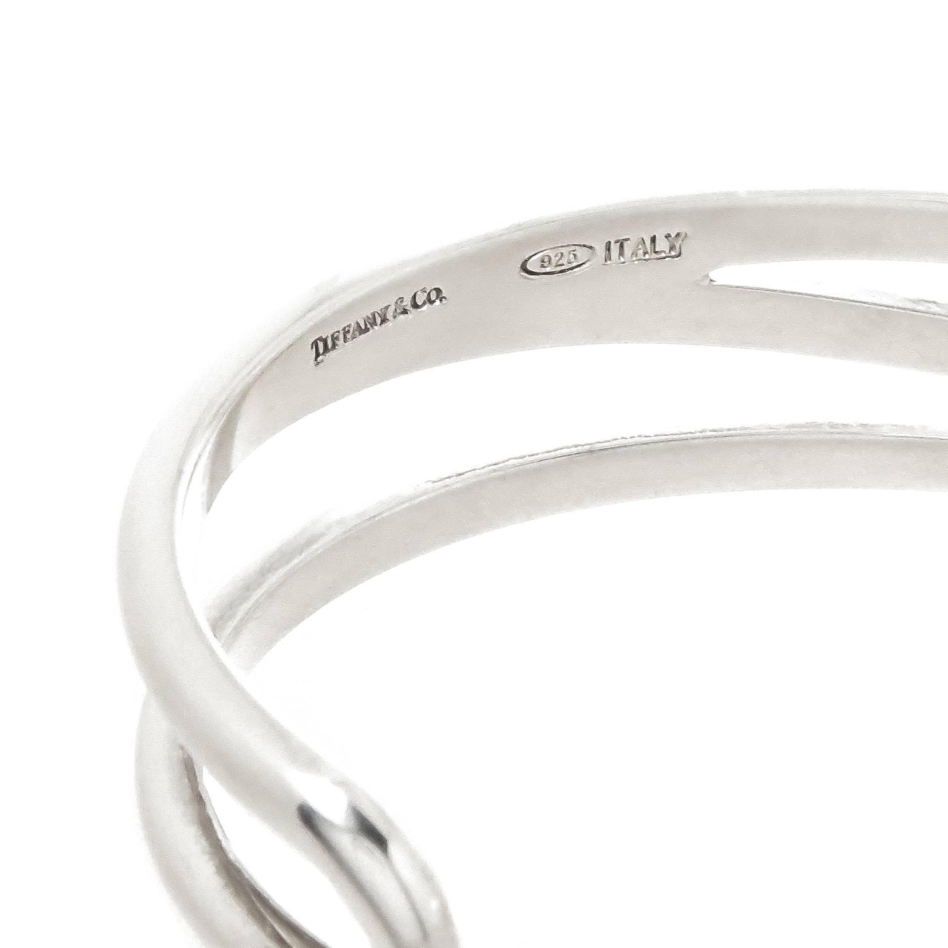 Circa 2000 Tiffany & Company Sterling Silver Cuff Bracelet, measuring 5/8 inch wide with an inside measurement of approximately 6 1/2 inches with an opening of 1 3/8 inches and can be squeezed a bit to make it smaller or larger if needed.  