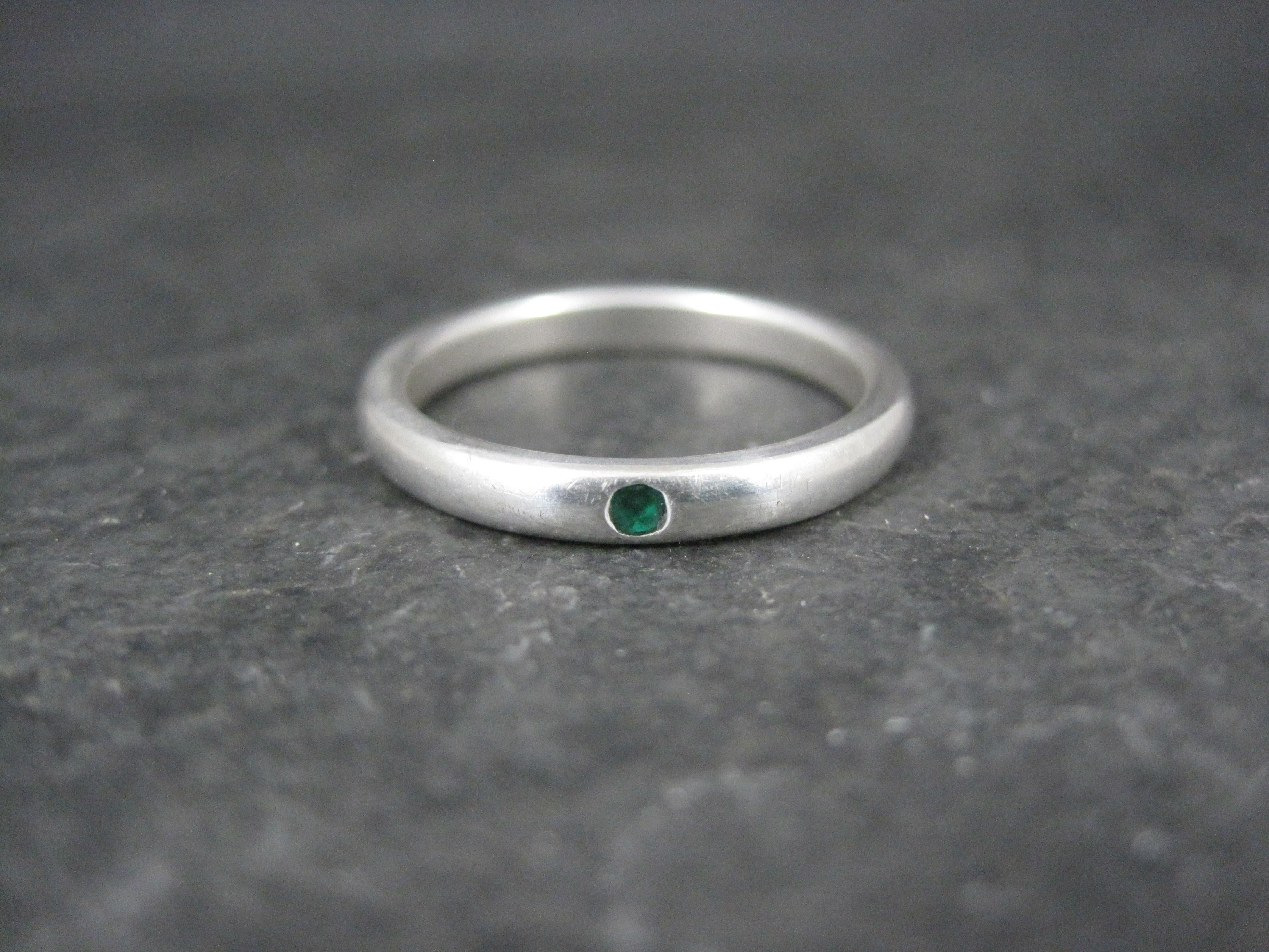 This beautiful band ring is a product of Elsa Peretti for Tiffany & Co.
It is sterling silver with a genuine emerald.

Measurements: 2.5mm wide
Size: 6 1/2

Marks: Tiffany & Co, 925, Peretti

Condition: Excellent