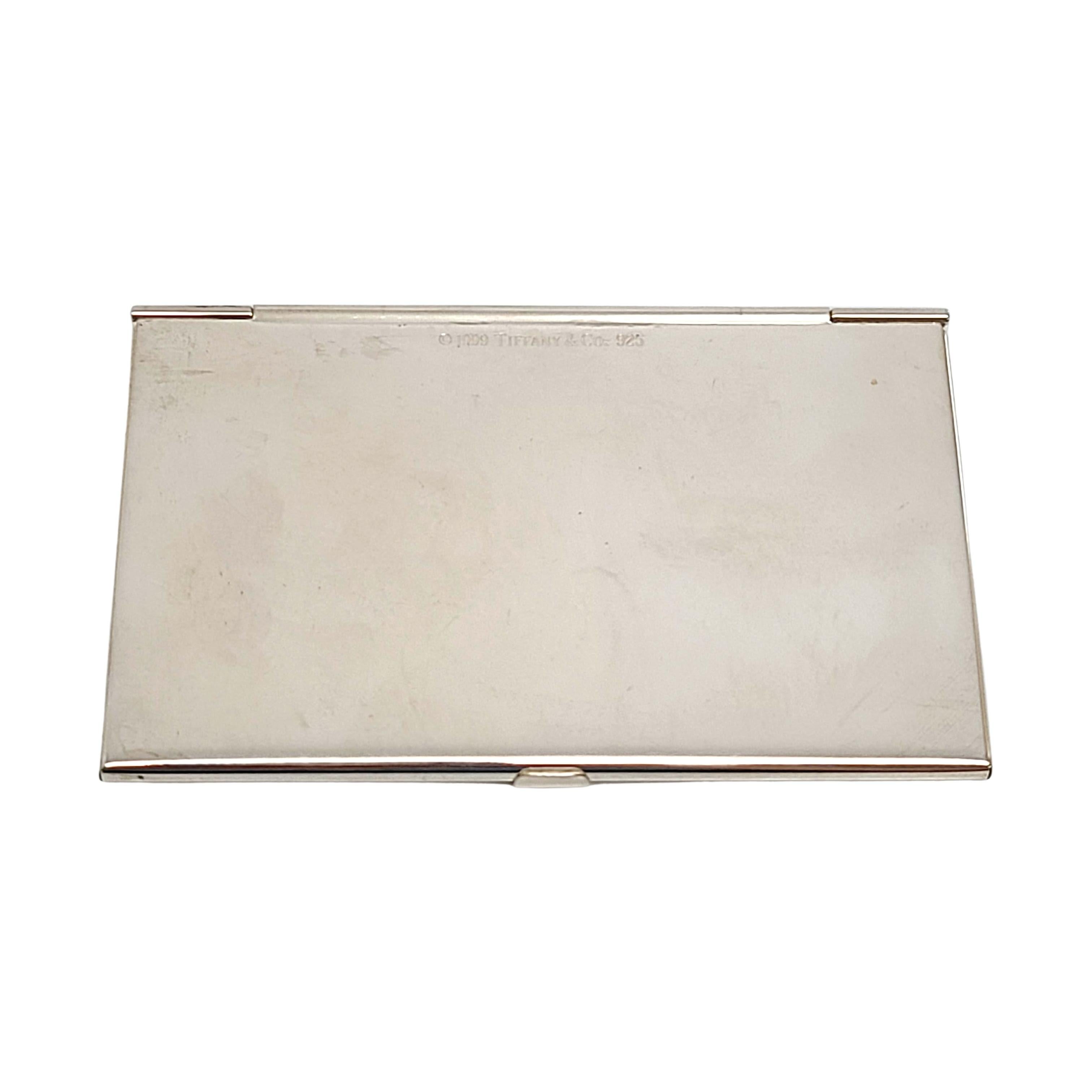 Sterling silver 1837 business card case by Tiffany & Co.

No monogram.

This simple and elegant piece features a smooth polished finish. Front cover features 925 in a triple diamond cartouche, T&CO 1837 in a frame. Can hold credit cards or business