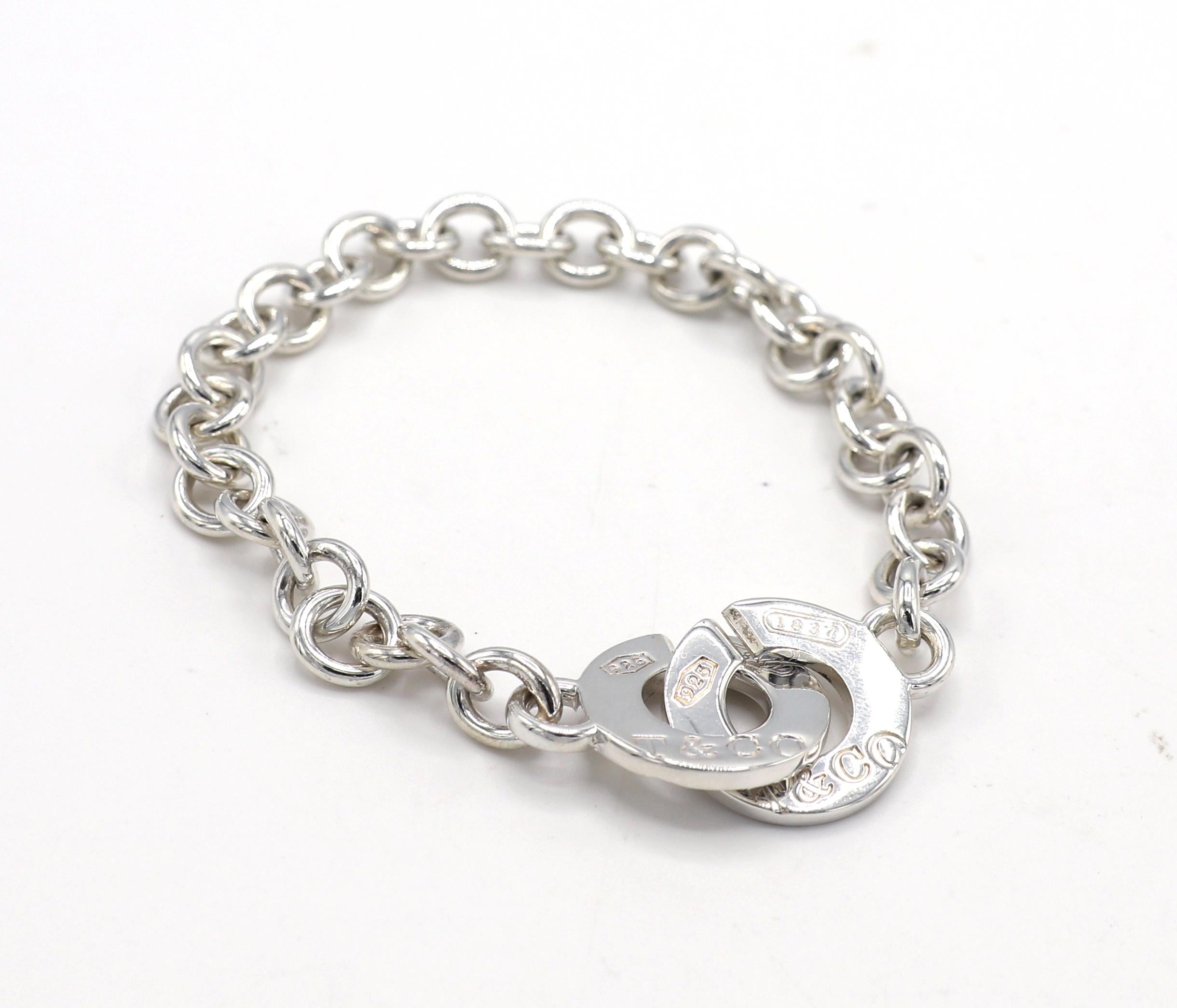 Tiffany & Co. Sterling Silver 1837 Interlocking Circle Chain Link Bracelet
Metal: Sterling silver
Weight: 22.47 grams
Length: 7.5 inches
Links: 7.5 x 8.5mm
Circle clasps: 18mm diameter