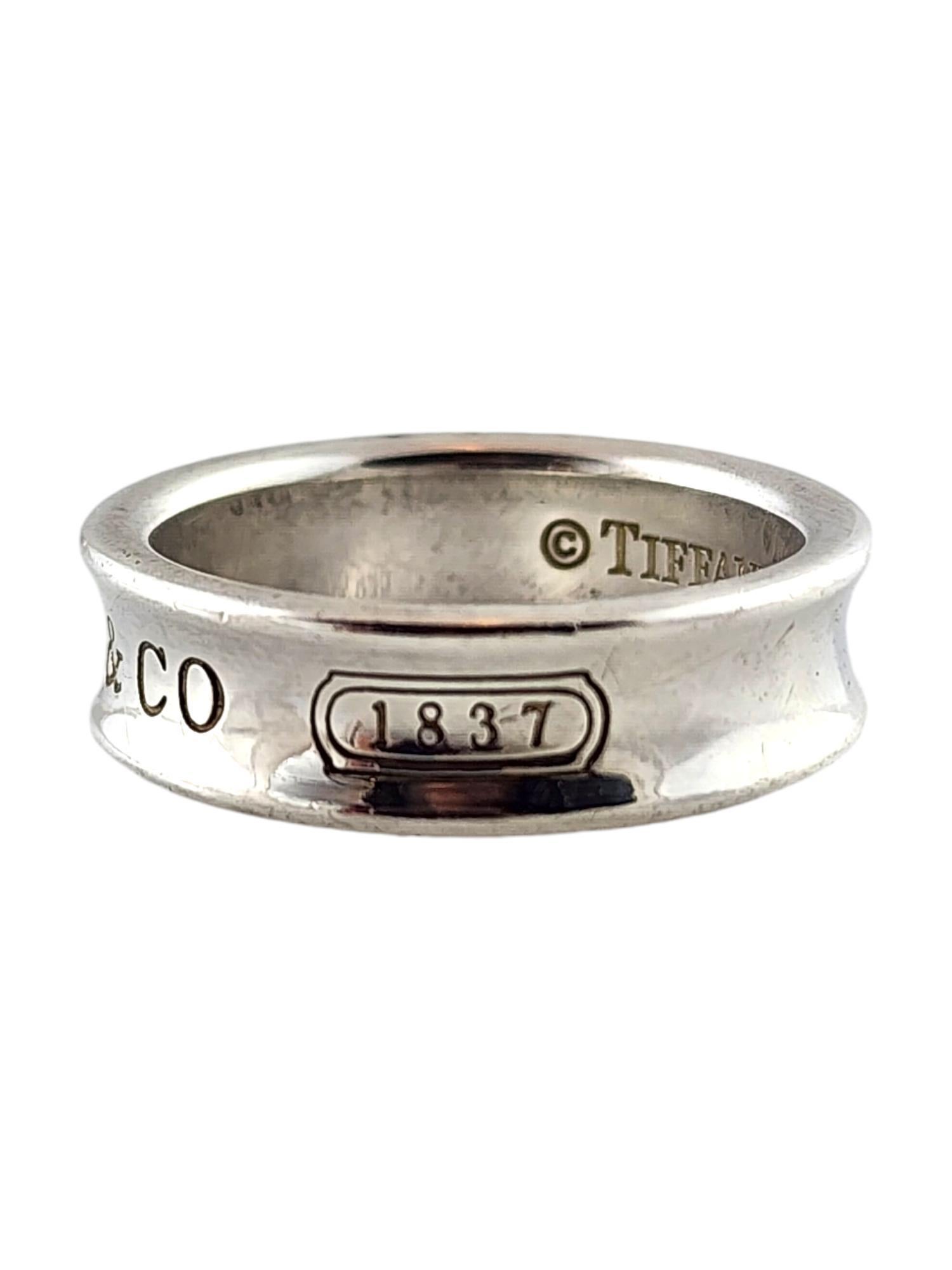 Tiffany & Co Sterling Silver 1837 Ring Size 10

This beautiful sterling silver 1837 ring by designer Tiffany & Co. will look amazing on you!

Ring size: 10
Shank: 6.80mm

Weight: 8.74 g/ 5.62 dwt

Hallmark: Tiffany & Co 925

Very good condition,