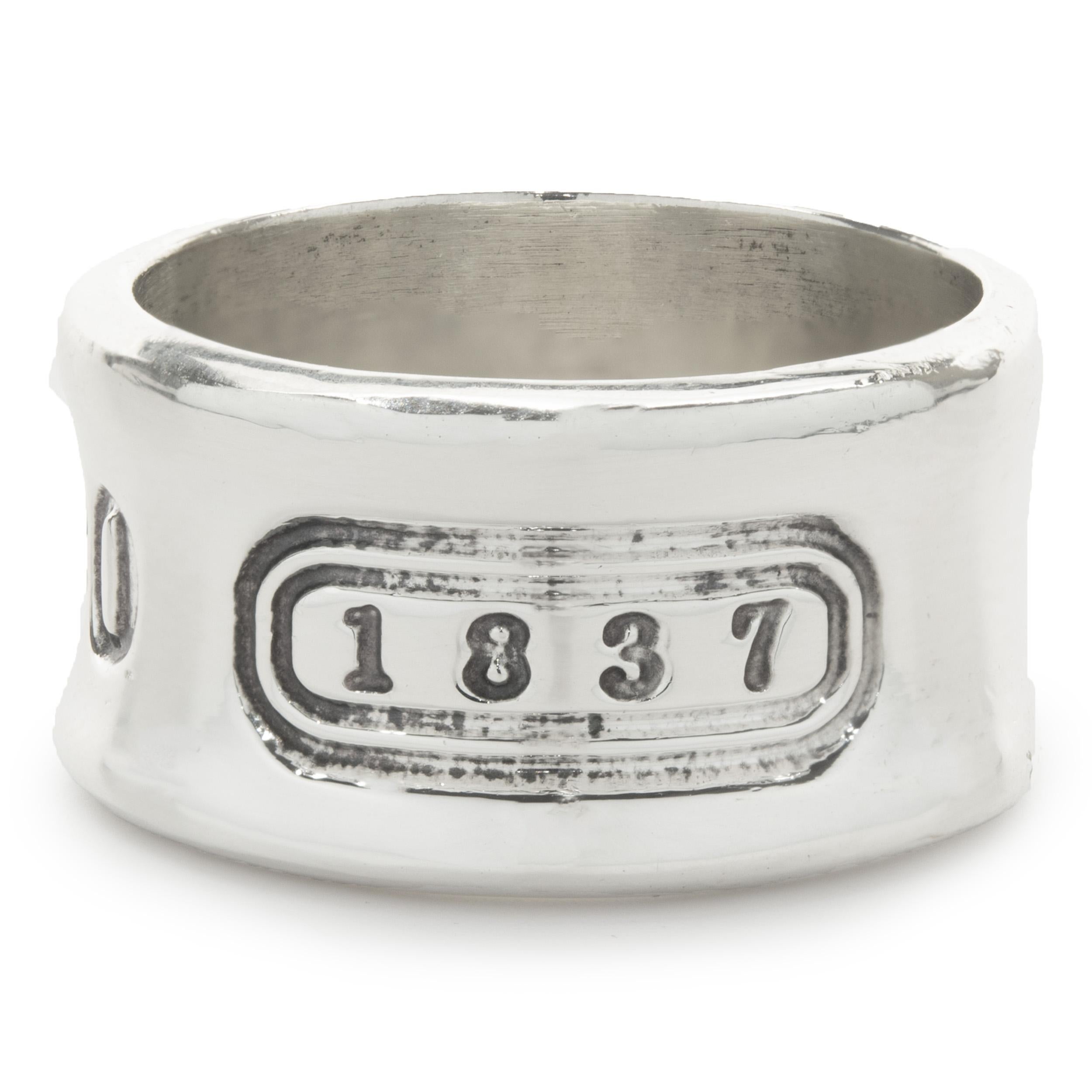 Designer: Tiffany & Co. 
Material: sterling silver
Dimensions: band top measures 11.30mm wide
Size: 8
Weight: 9.98 grams