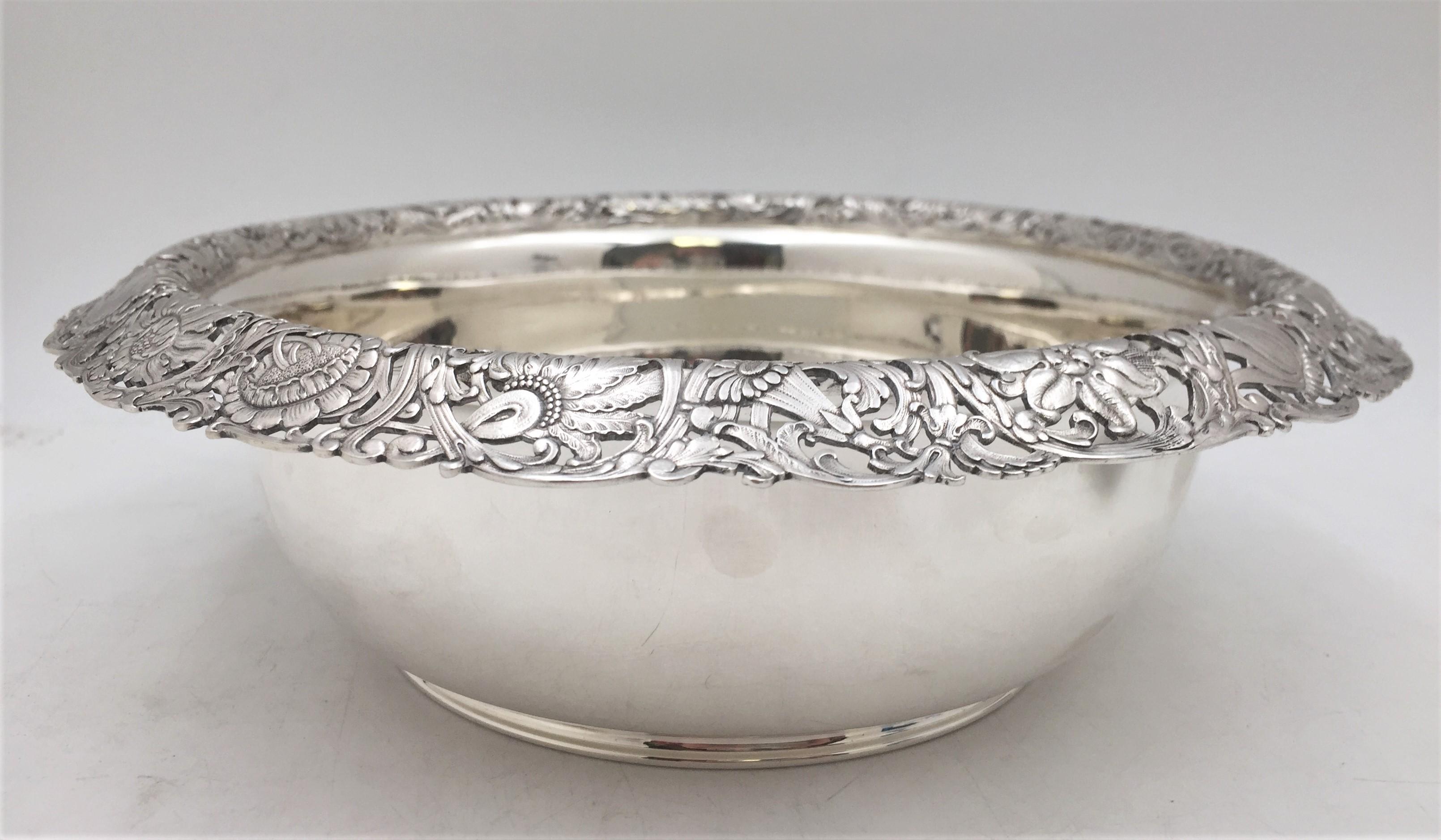 Tiffany & Co. sterling silver bowl in pattern number 9460 from the 1890s, in Art Nouveau style with flowing floral and palmette design adorning the rim. It measures 10'' in diameter by 3 1/8'' in height, weighs 21.8 troy ounces, and bears hallmarks