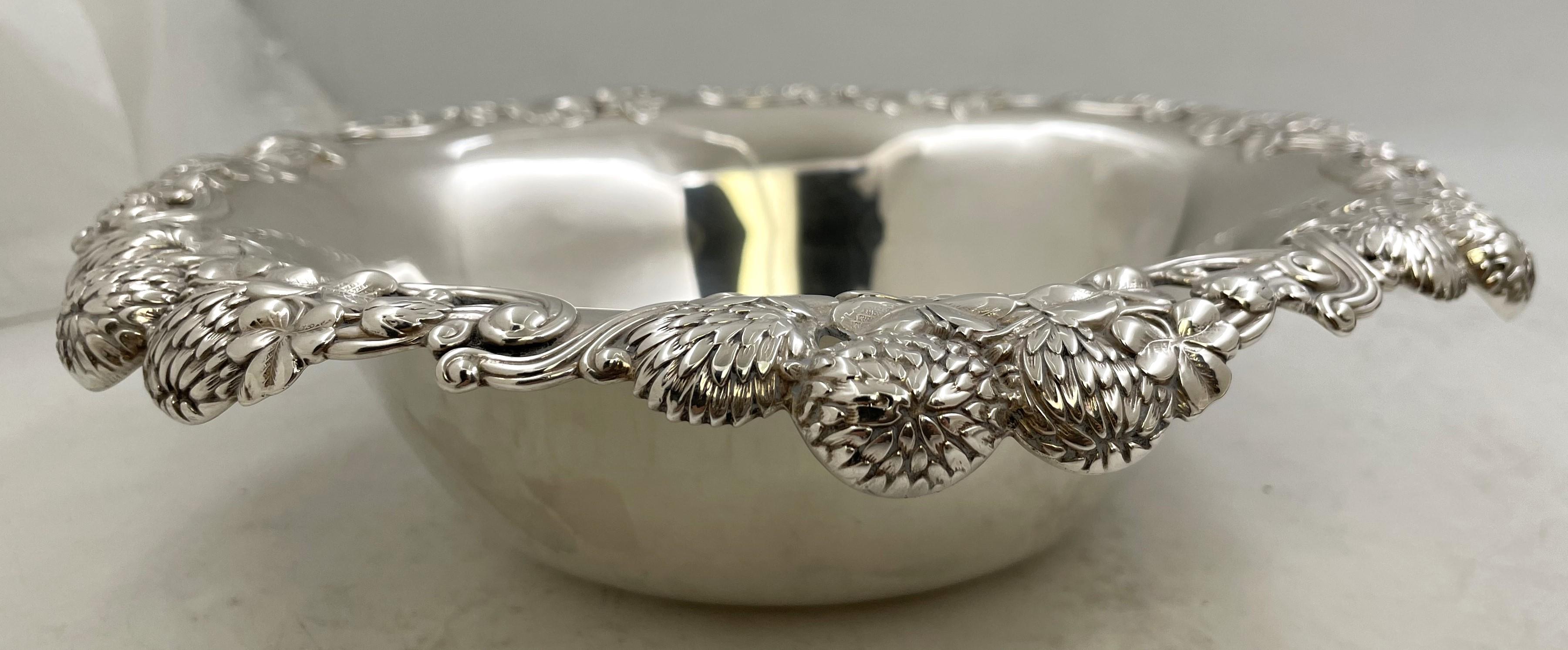 Tiffany & Co. sterling silver Clover bowl in pattern number 13780 from 1898 and in Art Nouveau style with clover and fruit motifs. It measures 10'' in diameter by 2 2/3'' in height, weighs 17.2 troy ounces, and bears hallmarks and a monogram as