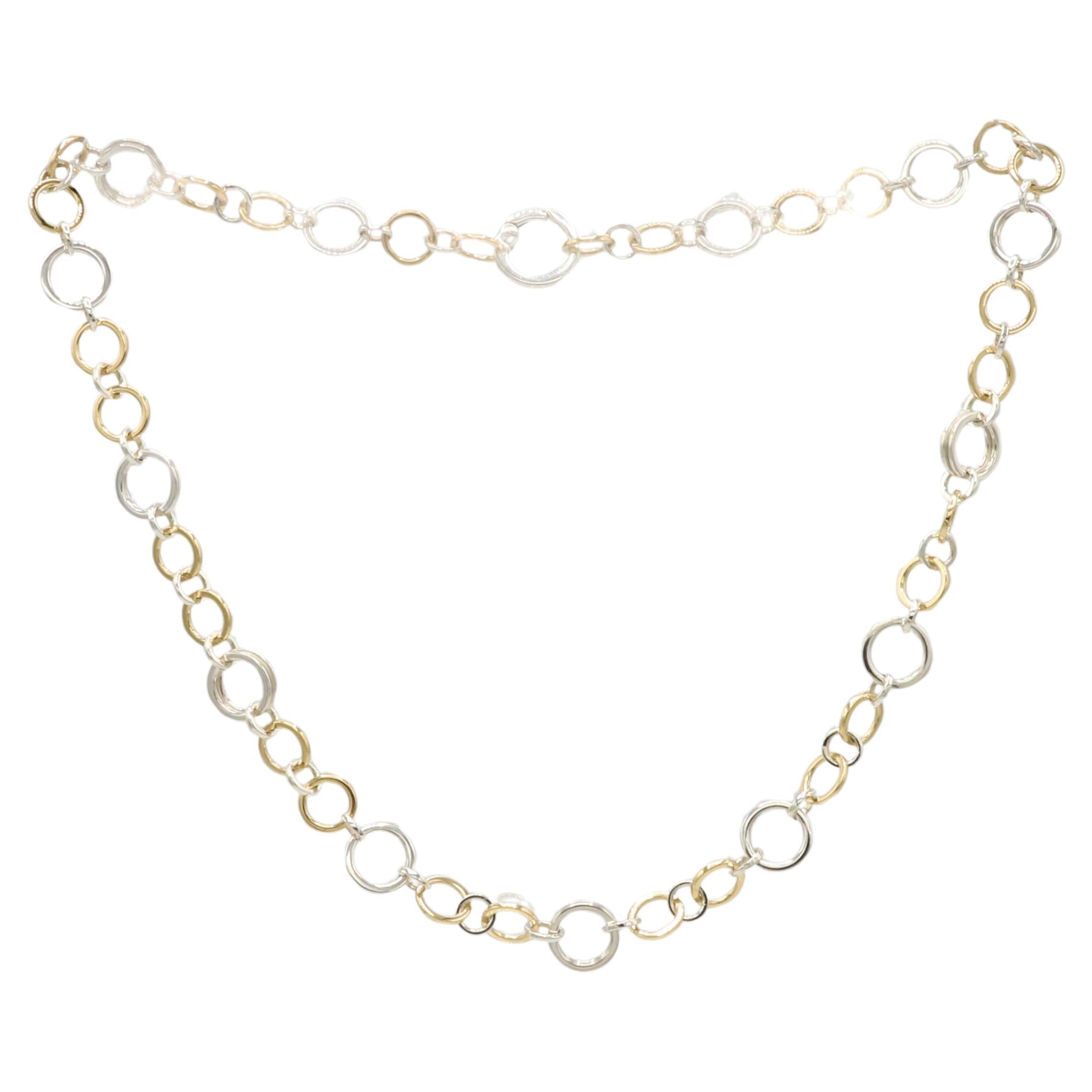 Tiffany & Co Sterling Silver & 18K Yellow Gold Circle Chain Link Necklace
Metal: Sterling silver & 18k yellow gold
Length: 18 inches
Links: 6.5 - 11mm 
Weight: 33.79 grams
Signed: ©Tiffany & Co. 925 750 ITALY