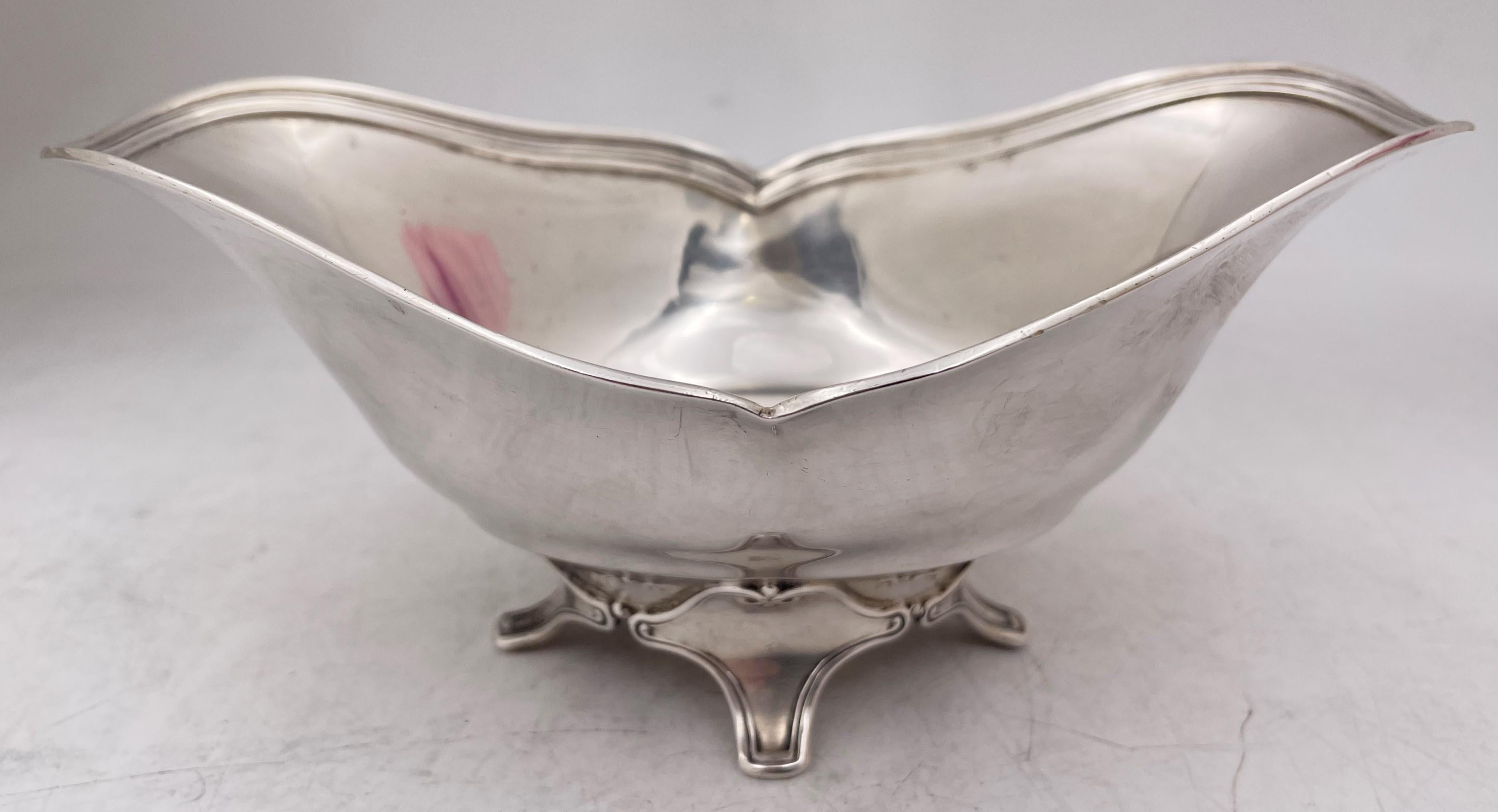 Tiffany & Co. sterling silver condiment dish or bowl in early Art Deco style and in pattern number 15602B from 1903 with an elegant design, standing on 4 legs. It measures 7'' in length by 4 1/4'' in width by 3 1/8'' in height, weighs 6.4 troy
