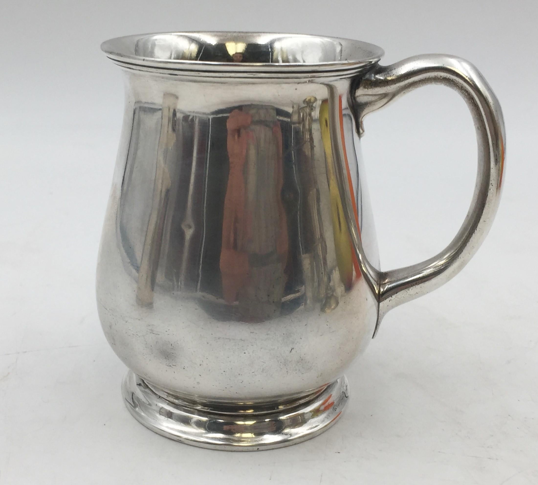 Tiffany & Co. sterling silver christening cup / child mug in pattern 16088 from 1904 in simple, elegant design, measuring 3 7/8'' in height and 3 3/4'' from handle to cup, weighing 5.7 ozt, and bearing hallmarks as shown.

Founded in 1837 by