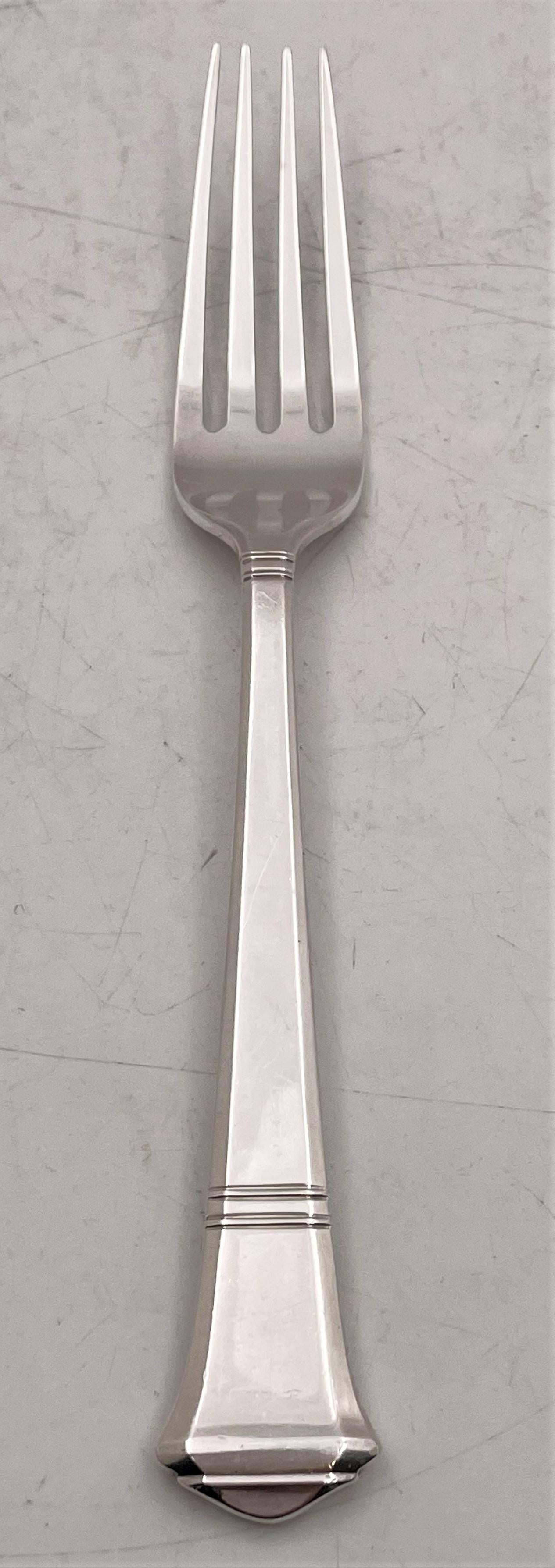 Tiffany & Co. sterling silver flatware set from 1923 in Art Deco style and in Windham pattern, with a beautiful geometric design, consisting of the following 48 pieces:

- 12 place forks measuring 6 7/8'' in length, including one larger measuring