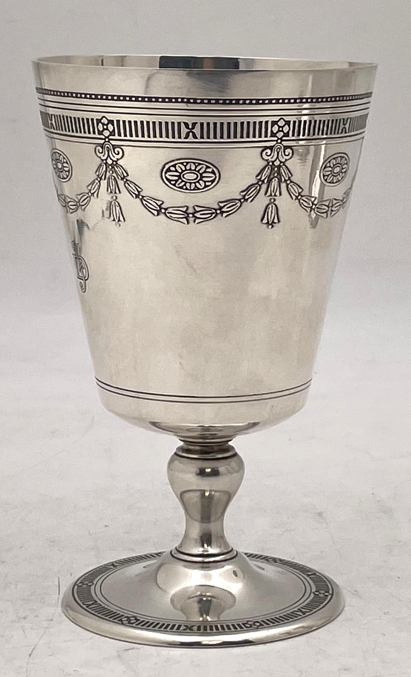 Tiffany & Co. sterling silver Kiddush cup or goblet in pattern number 20169A from 1923 and in Art Deco Style, with an elegant, geometric design, finely engraved with stylized motifs. It measures 5 1/2'' in height by 3 1/3'' in diameter at the top,