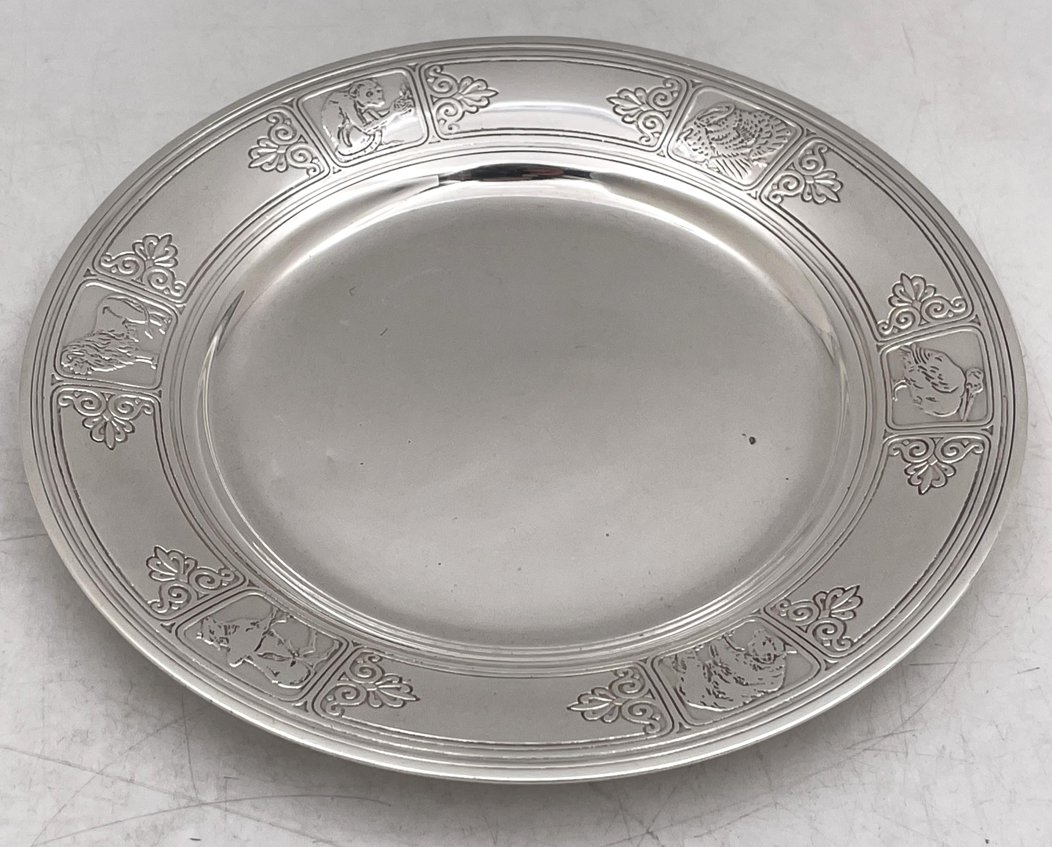 Tiffany & Co. sterling silver child's plate in pattern number 20960A from 1927, adorned with etched animal motifs. It measures 7 1/4'' in diameter by 2/3'' in height, weighs 8.7 troy ounces, and bears hallmarks as shown. 

The legendary Tiffany