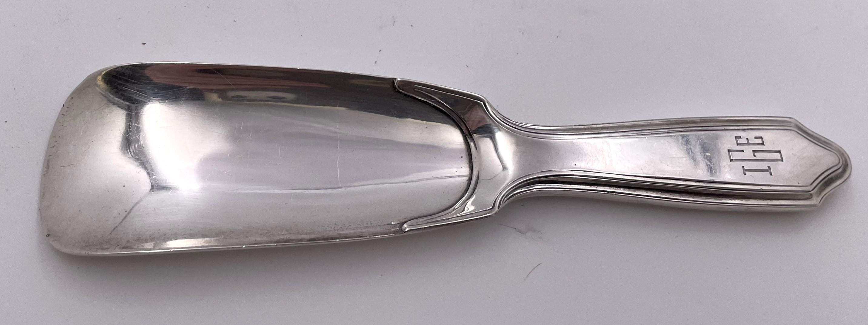Tiffany & Co. sterling silver shoehorn in pattern number 21010M from 1927 and in Art Deco style, with an elegant, geometric design. It measures 7'' in length by 1 3/4'' in width by 1 /2'' in height, weighs 2.1 troy ounces, and bears hallmarks as