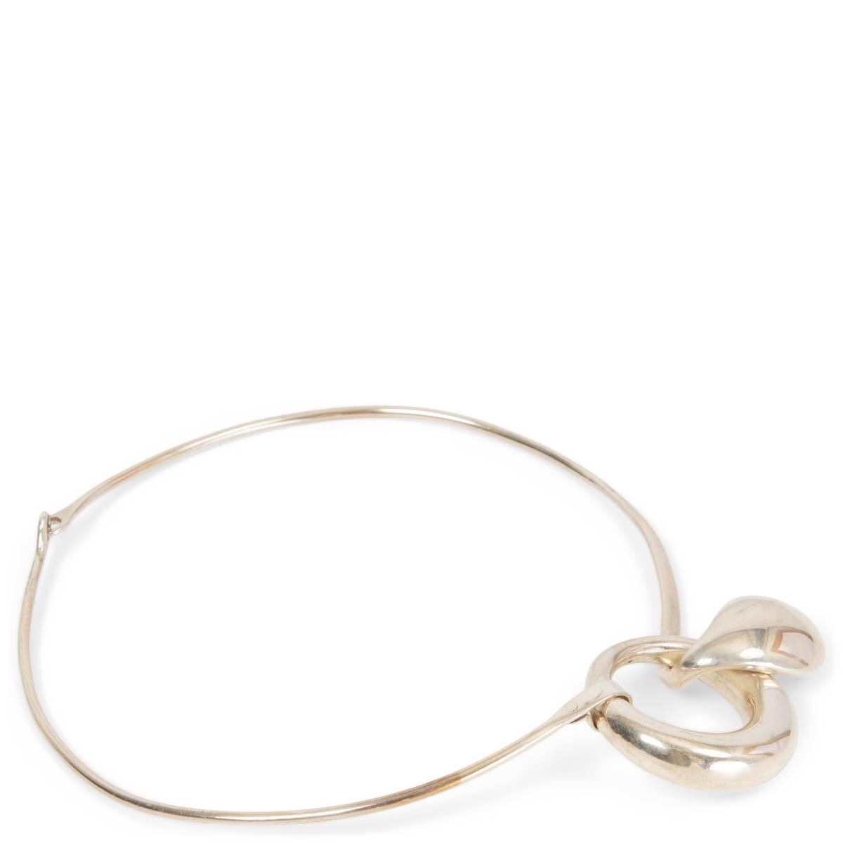 100% authentic Tiffany & Co. Vintage 70's Elsa Peretti sterling silver teardrop choker. Elsa Peretti’s iconic teardrop style jewelry is featured in this vintage sterling silver collar with fluid and organic shape, inspired by Halston and designed