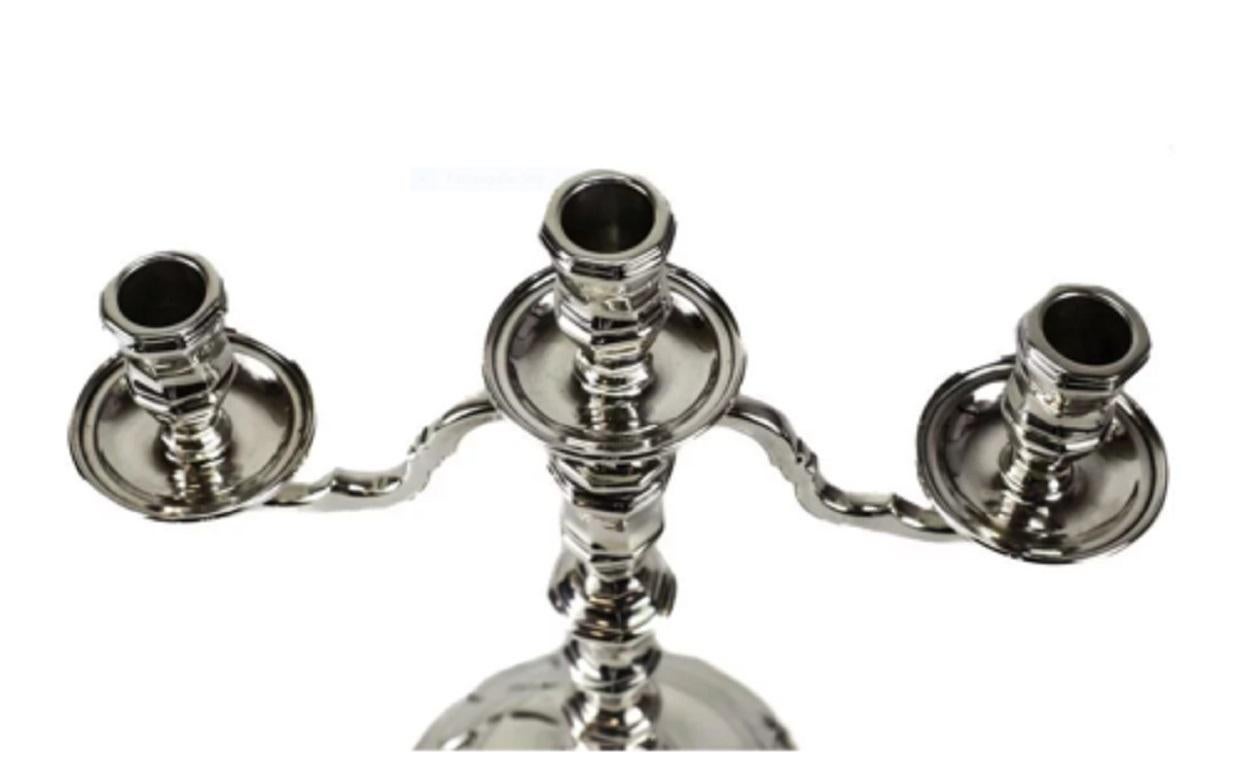 Tiffany & Co. sterling silver 3-light branch arm candelabra, circa 1970

The candelabra has a hand chased wave/swirl design to the base and stem. Marked to the underside base.

Additional Information:
Type: Candlesticks & Candelabras