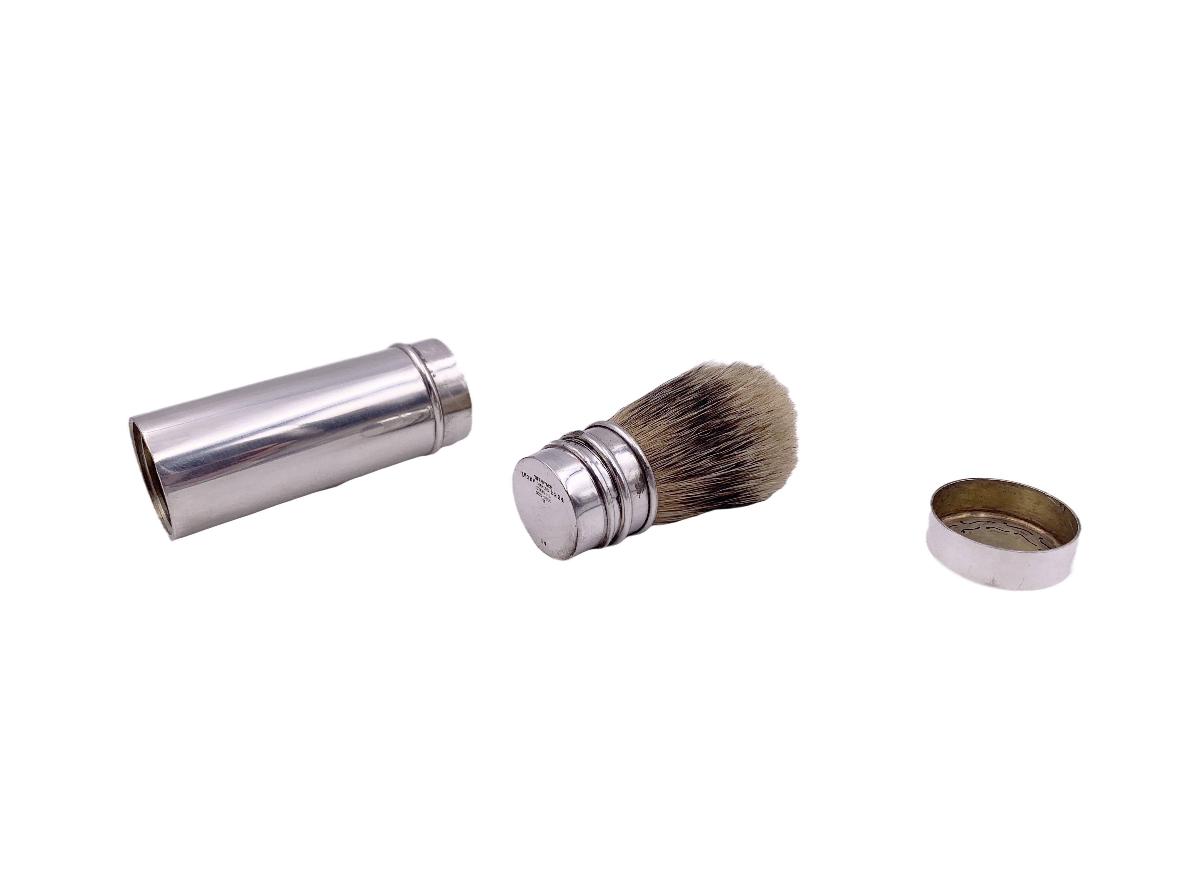 Tiffany & Co. Art Deco sterling silver, late 19th/ early 20th century 3-piece grooming set consisting of:

a box with a razor and other shaving utensils and which is gilt inside. It measures 2 1/8'' in length by 1 1/8'' in width. 
a lather brush