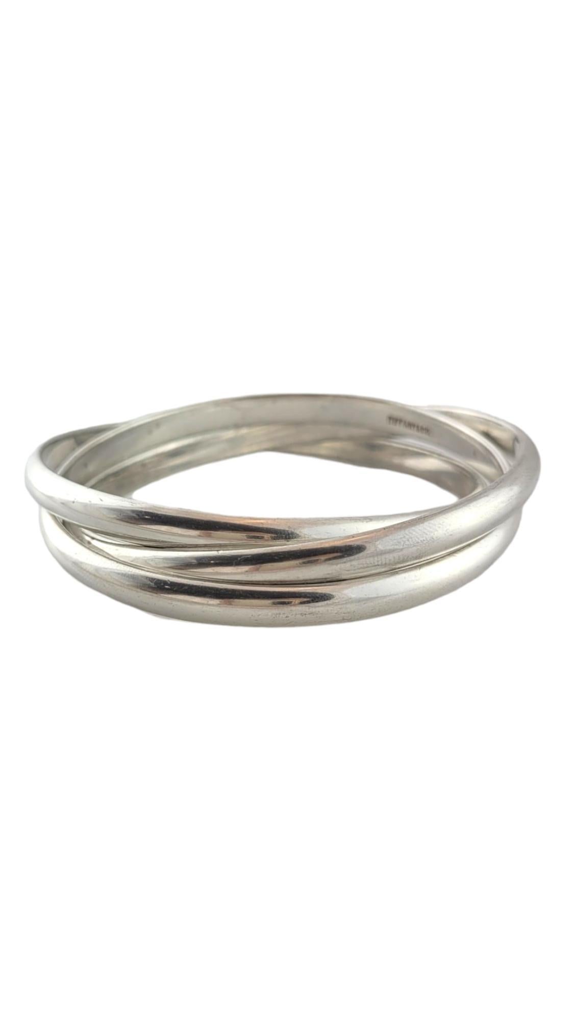 Vintage Tiffany & Co. Sterling Silver Rolling Bangle Bracelet

This gorgeous rolling three bangle bracelet by designer Tiffany & Co. is crafted from sterling silver!

Size: 7.75