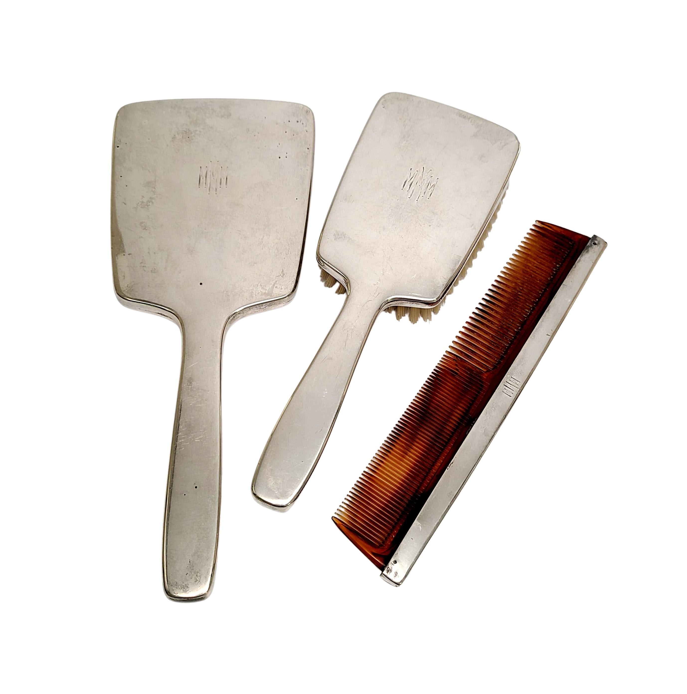 Sterling silver 3pc Dresser/Vanity Set by Tiffany & Co, circa 1940.

Monogram appears to be MMM

A simple and timeless classic polished design by Tiffany & Co. Set includes a mirror, a brush and a comb, each monogrammed.  Tiffany box and pouch not