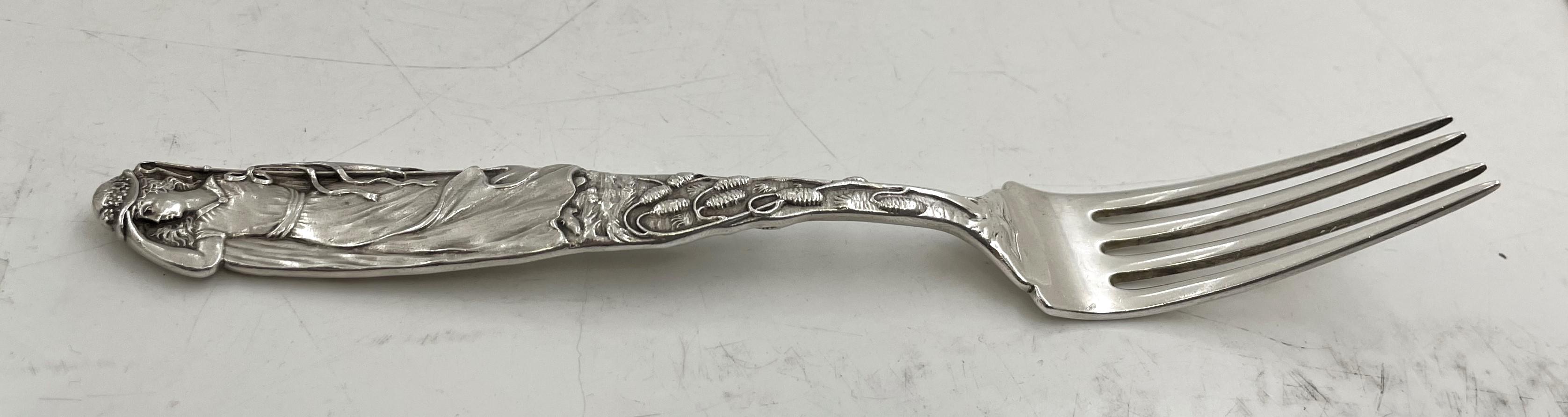 Tiffany & Co. rare sterling silver 4-piece child set in Nursery Rhyme pattern, consisting of:

an all-silver knife, measuring 7 1/2'' in length in the theme of the 