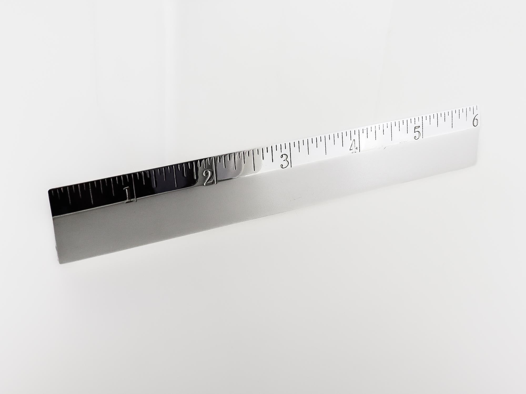 A fine 6-inch ruler.

By Tiffany & Co.

In sterling silver.

Simply a wonderful Tiffany everyday object!

Date:
20th Century

Overall Condition:
It is in overall good, as-pictured, used estate condition.

Condition Details:
There are some light