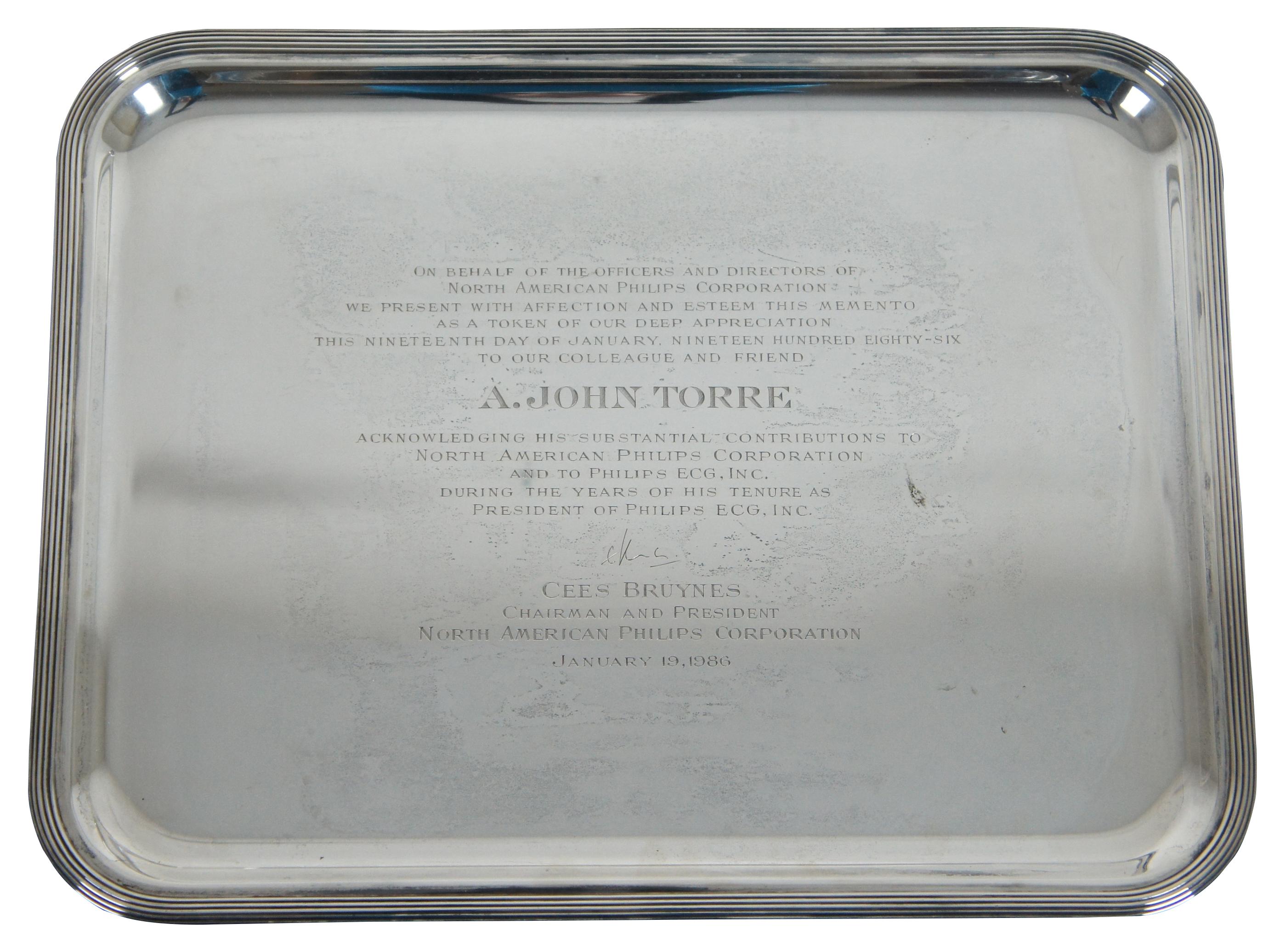 Tiffany & Co. sterling silver 925 engraved serving tray platter award trophy

Tiffany & Co sterling silver .925 tray that was given on behalf of the officers and directors of North American Philips Corporation to A. John Torre for his contributions