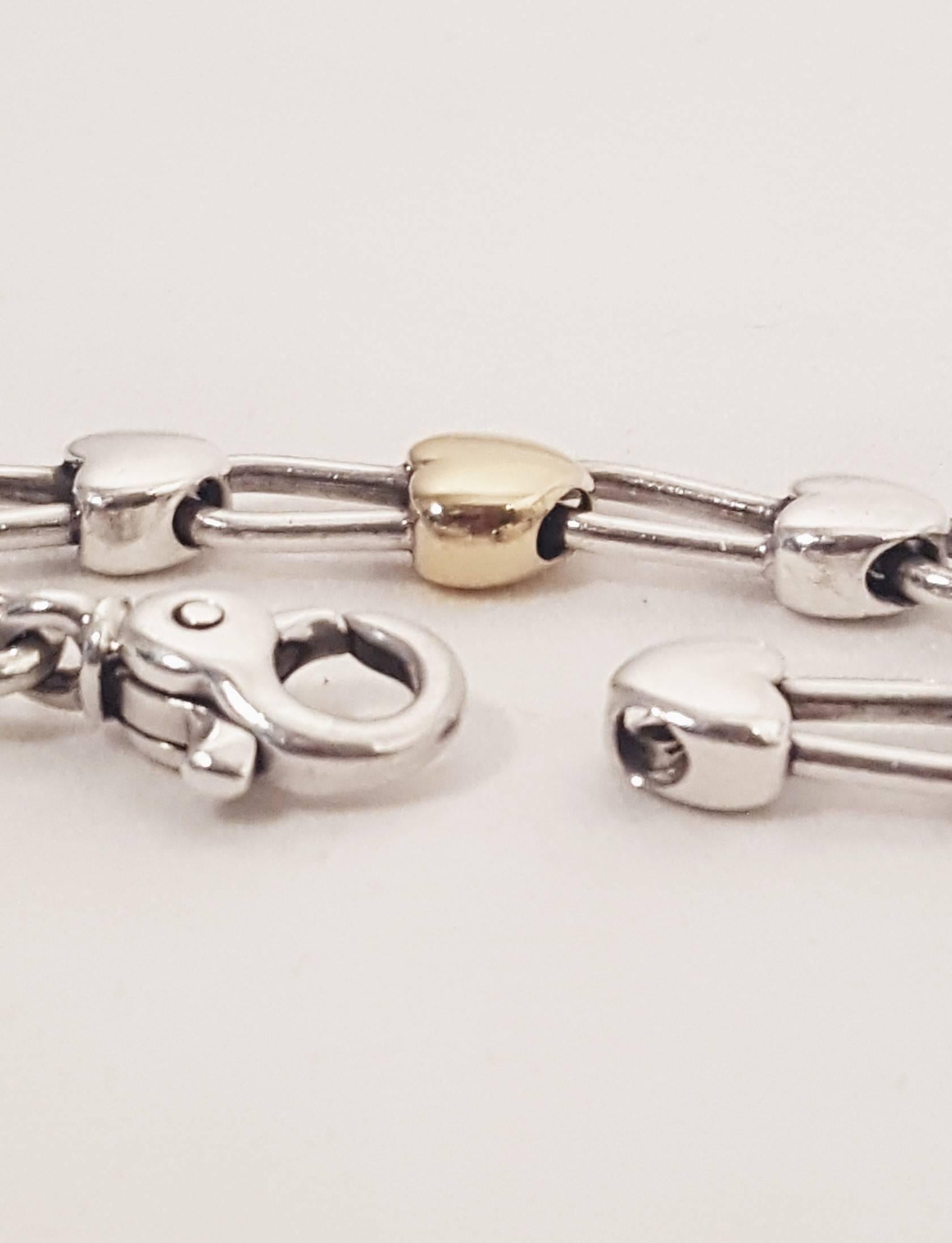 Tiffany & Co. Sterling Silver and 18 Karat Gold Inline Hearts Bracelet In Excellent Condition In Palm Beach, FL