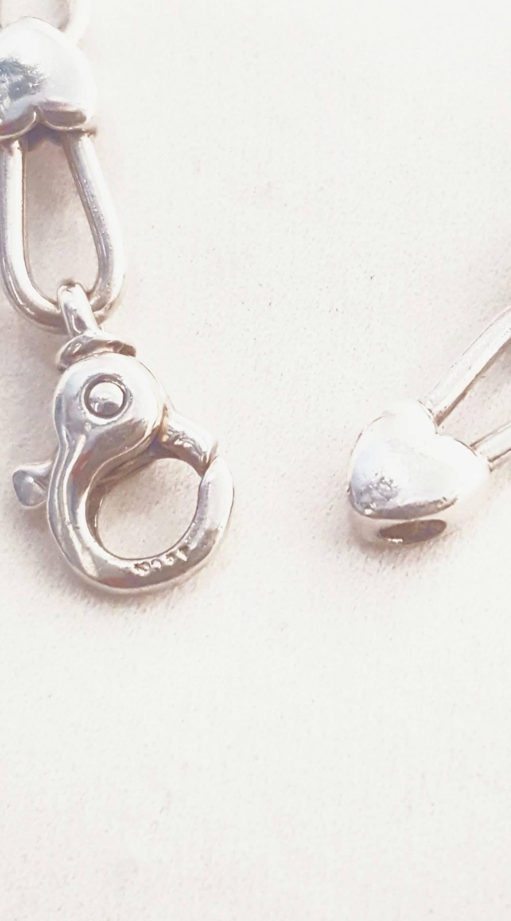 Contemporary Tiffany & Co. Sterling Silver and 18 Karat Gold Inline Hearts Necklace