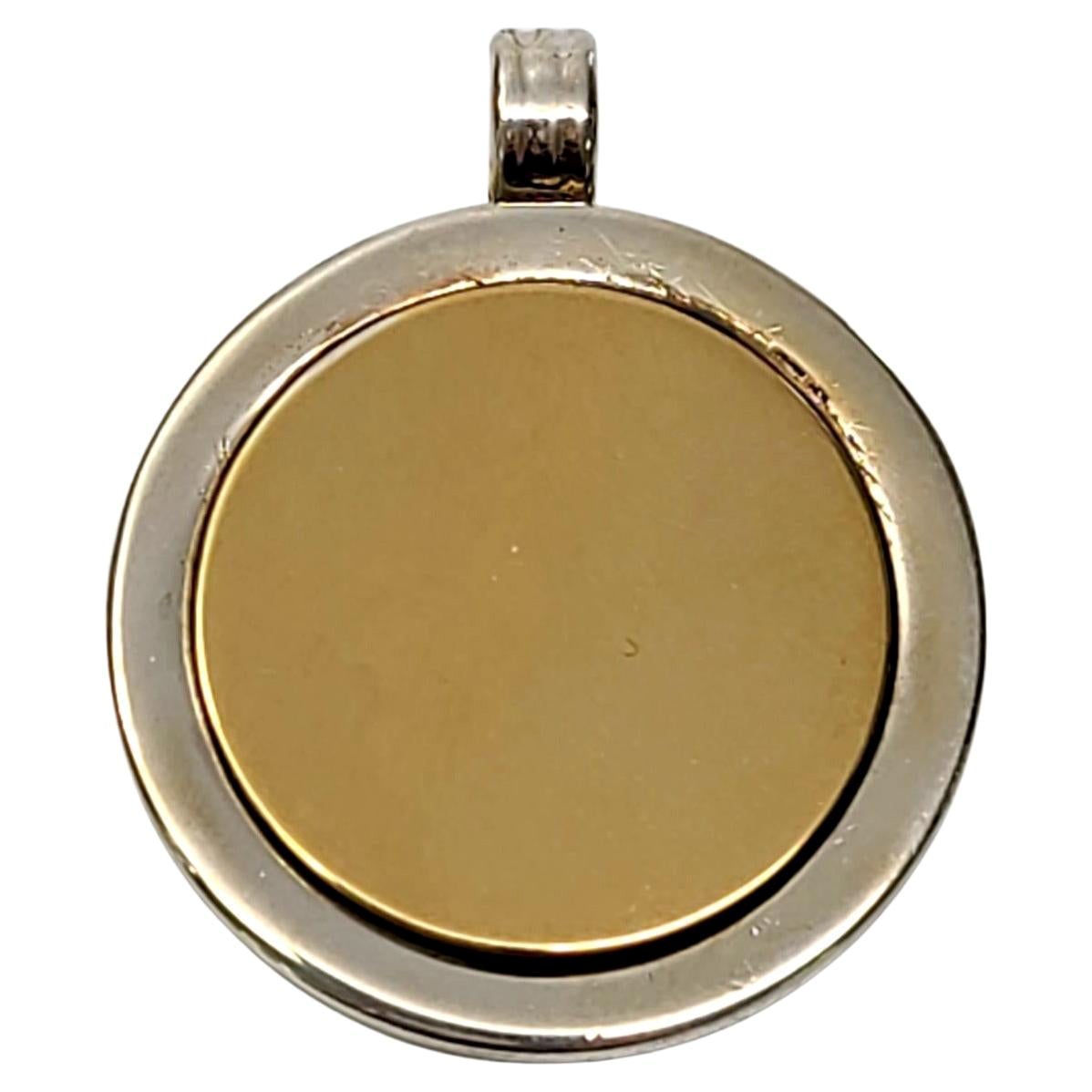 Tiffany 
Co. Sterling Silver and 18K Yellow Gold Disc Pendant