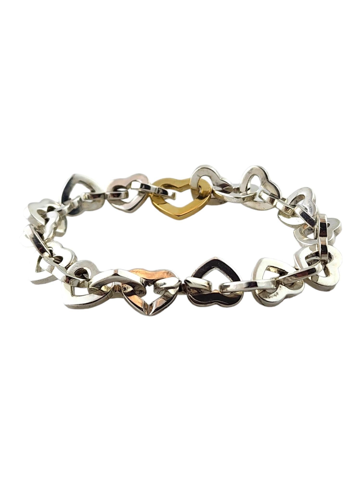 Tiffany & Co Sterling Silver and 18K Yellow Gold Heart Link Bracelet

This gorgeous heart link bracelet by Tiffany & Co was crafted from sterling silver with one beautiful 18K yellow gold heart to make this piece pop!

Size: 6.5