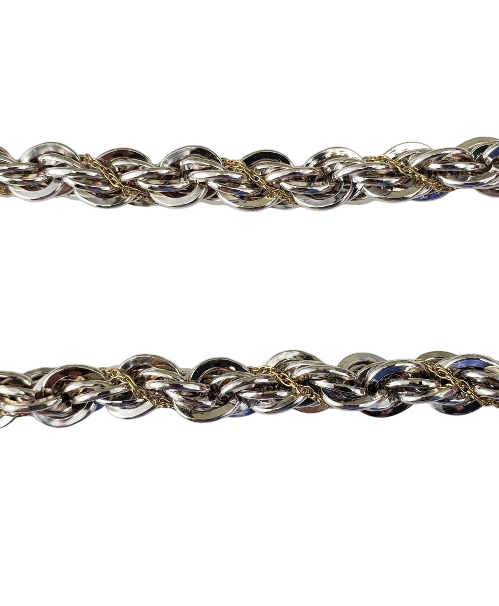 Tiffany & Co. Sterling Silver and 18K Yellow Gold Rope Chain-

This elegant rope chain by Tiffany & Co. is crafted in sterling silver and 18K yellow gold.  Width: 6 mm.

Hallmark: TIFFANY 7 CO. 750  925

Size:  28.5 inches

Weight:   51.5 dwt. /