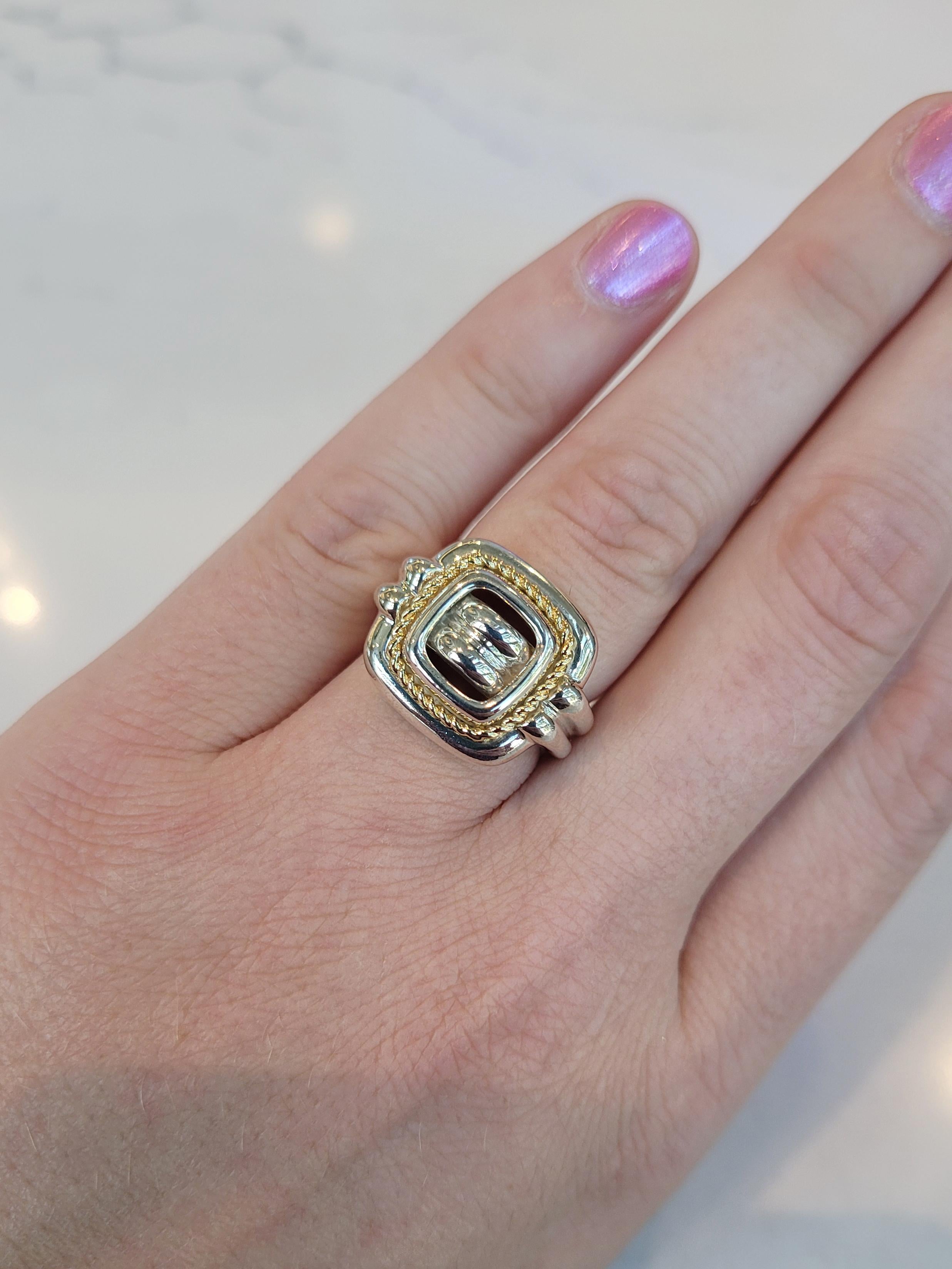 Vintage Tiffany & Co. sterling silver ring featuring an 18K yellow gold twist accent.