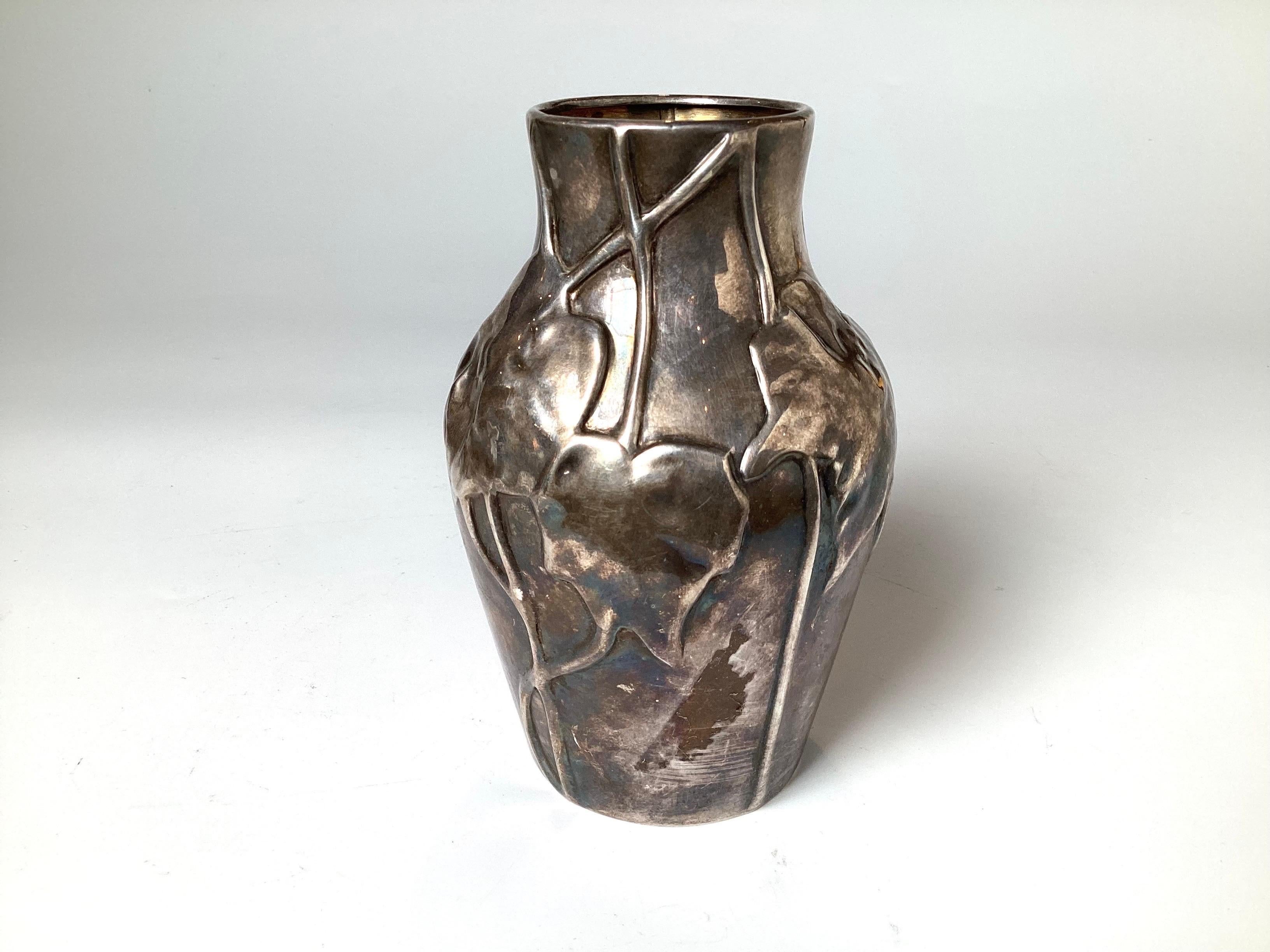 Tiffany and Company sterling silver art nouveau vase from the Louis Comfort Tiffany Collection. The art nouveau style with a leaf decoration all over, marked on bottom. 5.5 inches tall.