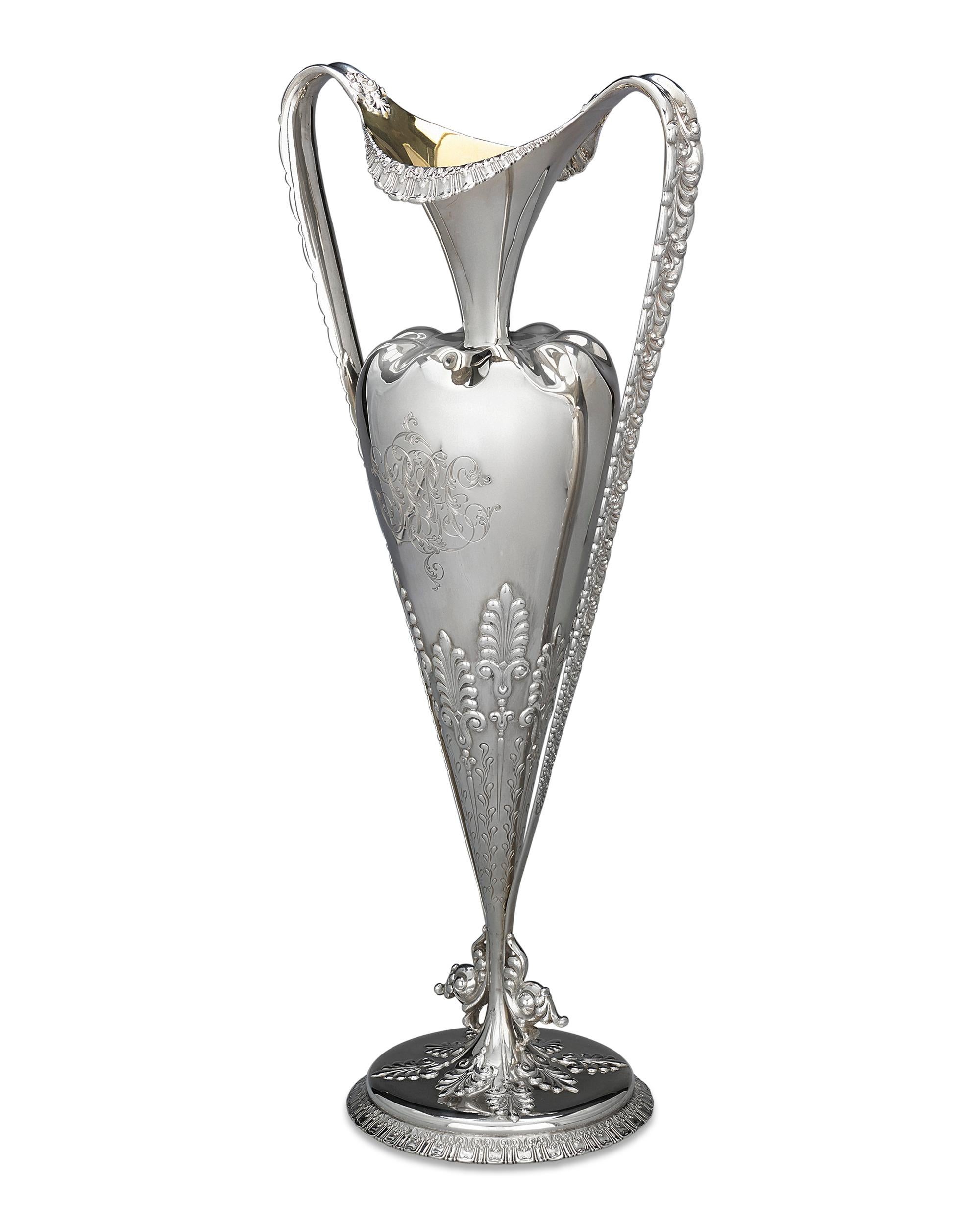 This sterling silver vase is an impressive piece of Art Nouveau artistry by Tiffany & Co. Both practical and striking, this vase embodies the fashionable style that pervaded the arts at the turn of the century, with the flowing curves and naturalist