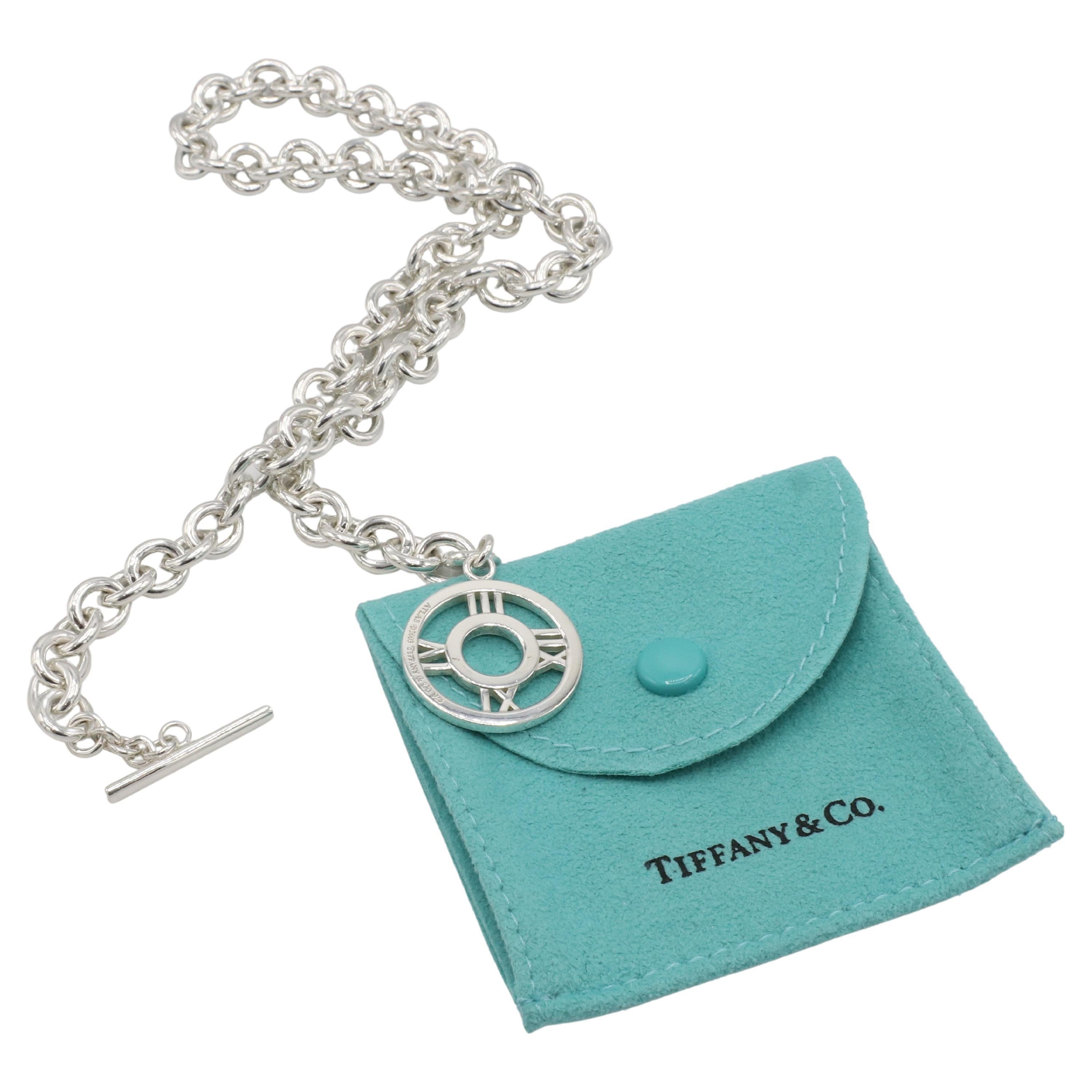 Tiffany & Co. Sterling Silver Atlas Chain Link Toggle Necklace 
Metal: Sterling silver
Weight: 60.14 grams
Length: 17 inches
Disc: 23mm
Links: 8 x 9mm
Signed: ATLAS ©2003 Tiffany & Co. 925
