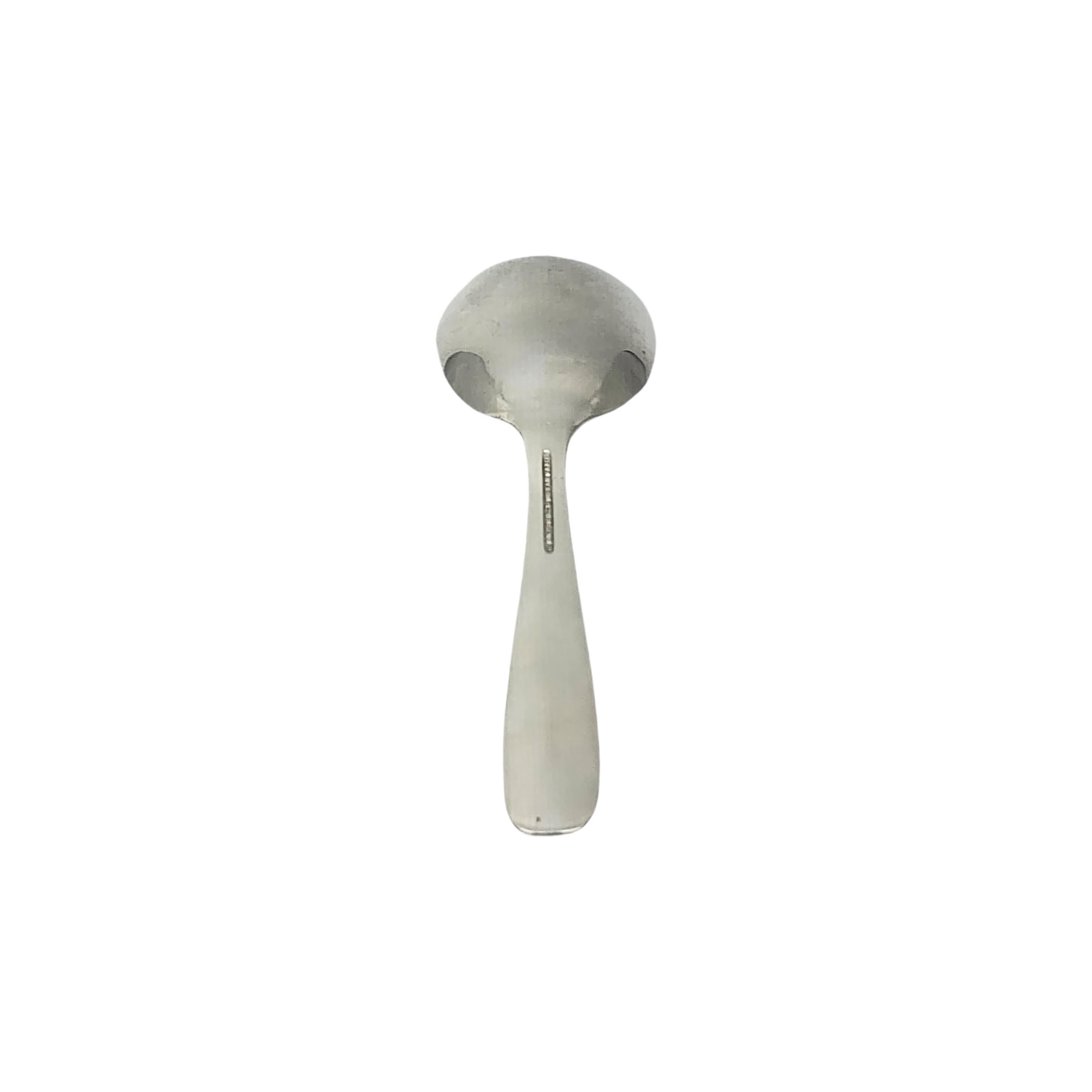 Tiffany & Co sterling silver child/baby feeding spoon.

No monogram or engraving

A small spoon in the simple and classic design. Hallmarks date this piece to manufacture under the directorship of John C. Moore II, 1907-1947. Does not include