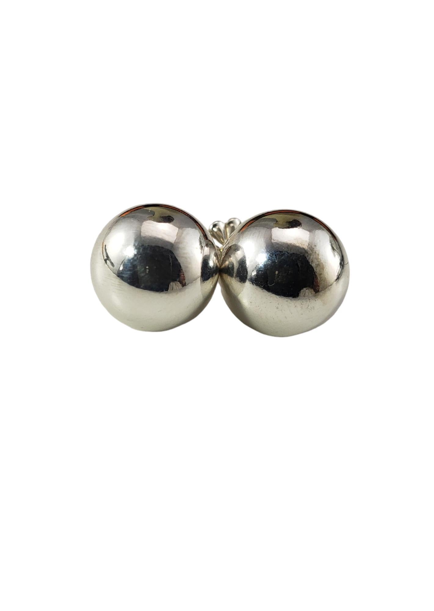 Tiffany & Co. Sterling Silver Ball Earrings

These elegant ball earrings by Tiffany & Co. are crafted in classic sterling silver.  

Width: 10 mm.  Push back closures.

Matching bracelet: #17162
Matching necklace: #17161

Size: 10 mm

Hallmark: 