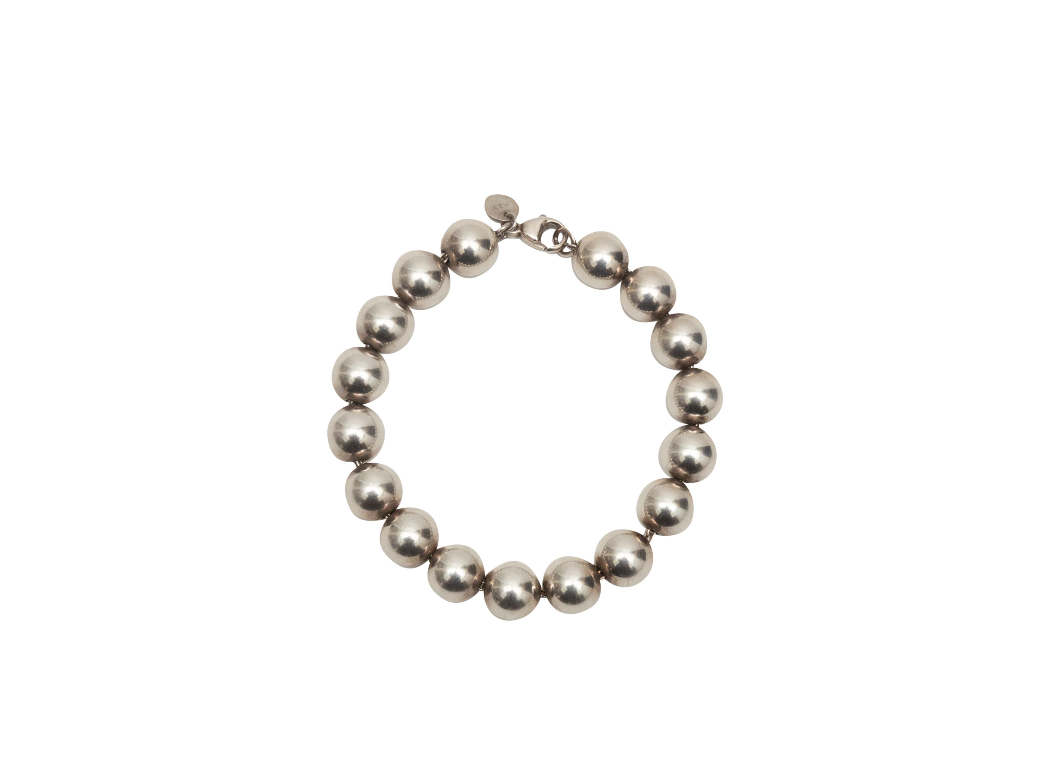 Product Details: Sterling silver ball bracelet by Tiffany & Co. Lobster claw clasp closure at end. 3